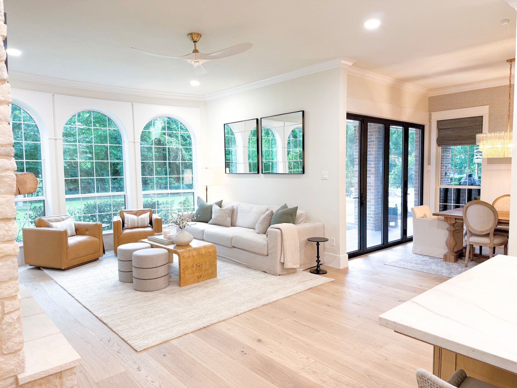 Last space to share from this incredible full-service renovation & decorating project! The new arched cabinet, the stone fireplace, the reimagined windows, the elevated furnishings…it’s now the perfect extension off their gorgeous new kitchen. 
#WoodlandsStyleHouse
Construction: @richmarkremodeling

#LTKHome #LTKStyleTip #LTKSaleAlert