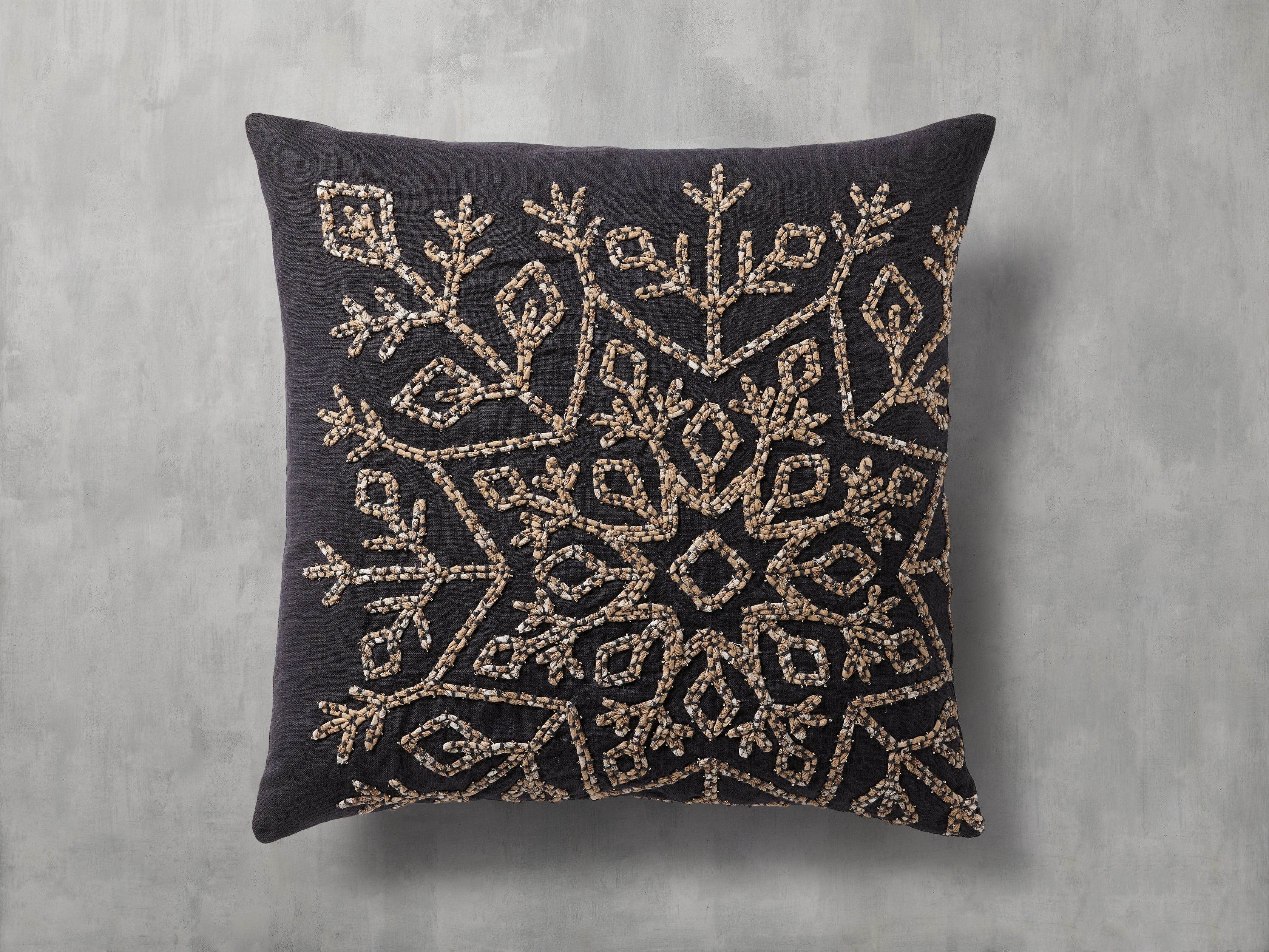 Embroidered from repurposed materials, Sindri’s intricate snowflake design paired with its knif... | Arhaus