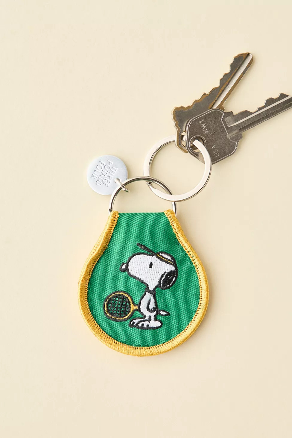 Three Potato Four X Peanuts Snoopy Tennis Patch Embroidered Keychain | Urban Outfitters (US and RoW)