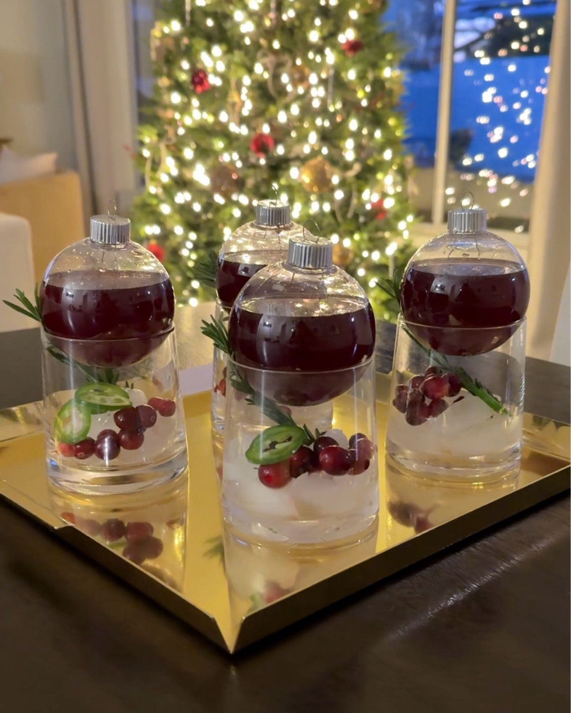 Cocktail ornaments! Give your guests a fun and interactive experience with their drinks! Just mix up your favorite drink and pour into a clear Christmas ornament. Replace the top and sit it on any drinkeware! 
••••
Clear ornaments, Christmas drinks, Christmas cocktails, cocktails in ornaments, drinks in ornaments, holiday hosting, party idea, rocks glasses, holiday party, festive drinks 

#LTKHoliday #LTKHome #LTKSeasonal