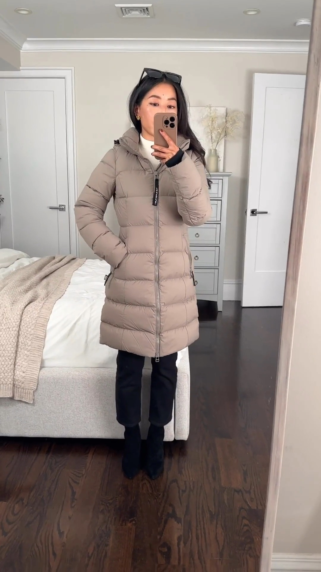Updated video per requests showing this coat zipped up

Black Friday is the only time aritzia down puffer coats ever get discounted! Water and wind resistant, very warm and lightweight. 

This is xxs (2xs) in the super snug superpuff style.

length: they have short, Mid, and Long. I am 5 feet tall and mid hits me as shown

• fit: they have original or SuperSnug. SuperSnug in XXS (2XS) is fitted on me and slim through the arms. 

If you like chunky layers and looser silhouettes underneath, then their more popular option is the original super puff which is less fitted in the torso and sleeves. 

• material: Material is a lightweight down fill with a wind and water resistant outer, and is machine washable • this color us modern taupe

Linked a few other lengths and colors of the Snug fitting puffer. Loving the glossy black!

• Justine boots 5

Black Friday cyber Monday sales  , winter outerwear 

#LTKCyberWeek #LTKSaleAlert