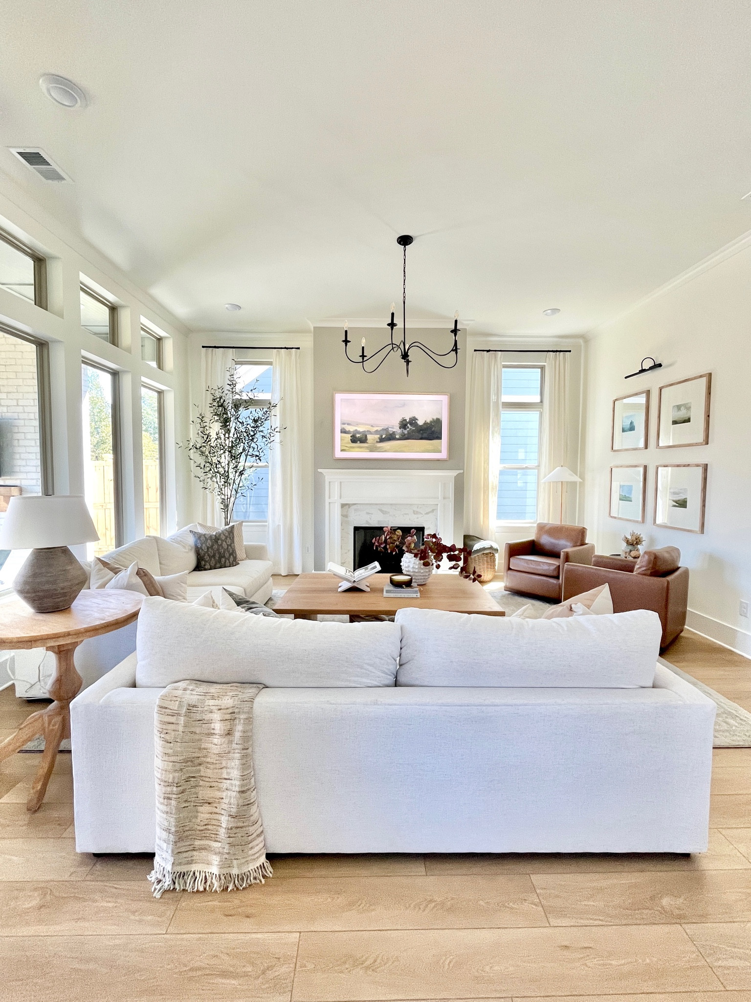 My modern coastal living room design is almost complete! My gallery wall is in, frame tv hung, and all of my throw pillows, rugs, and decor!  

#LTKhome #LTKfamily #LTKsalealert