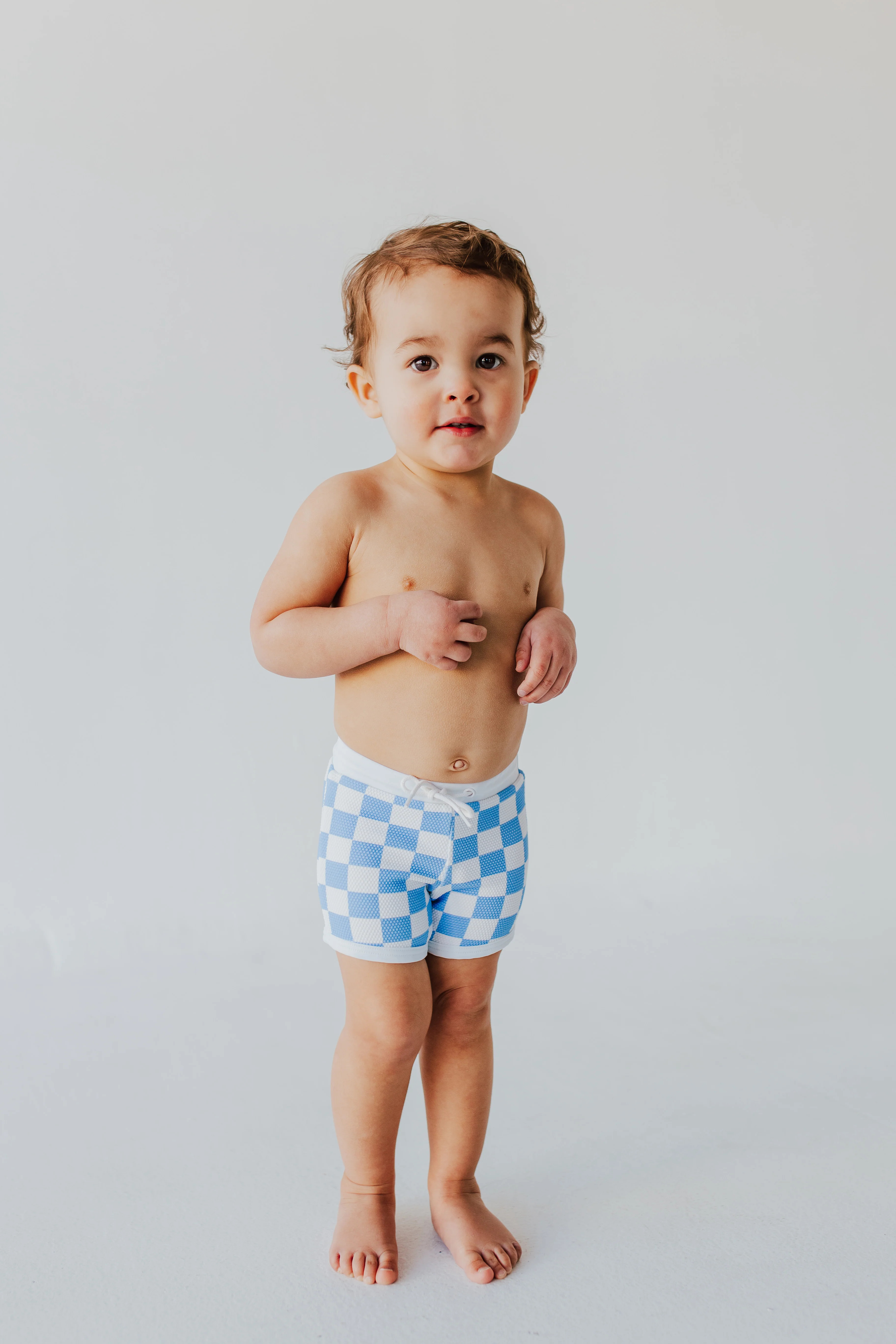 BOYS EUROPEAN SWIM SHORT IN BLUE CHECKER BY PINK DESERT | Pink Desert
