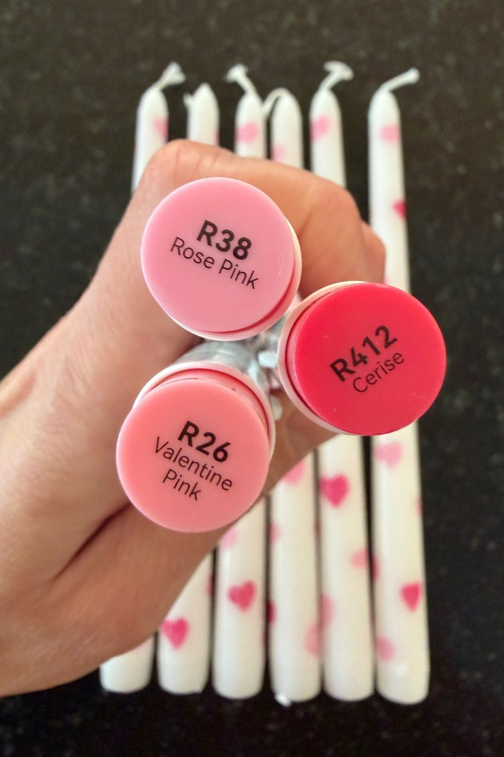 I DIY'd these cute heart candles for around $1 each! Just draw hearts using the markers I linked and ta-da! I have a quick step-by-step tutorial on the blog and you can also find all the colors I used in that post: www.tantrumsandtools.com. If you'd rather just purchase, I linked the inspiration for this project too. There are many cute options for valentine's taper candles.  #Valentinesdaydecor #Valentines #Valentines day #Galentine #februaryfavorites #Hearts  

 #LTKSeasonal #LTKHome