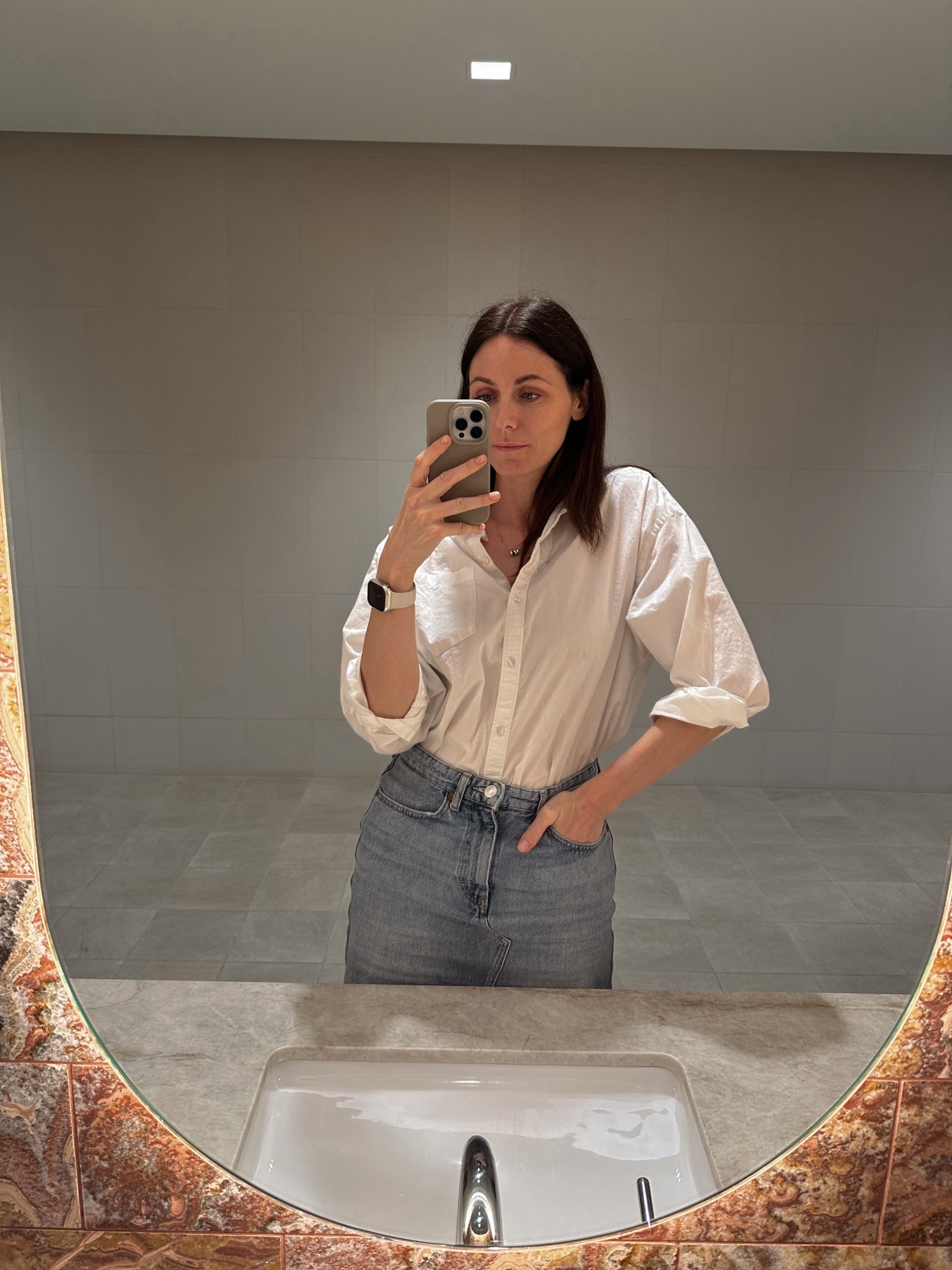 A white button-down shirt is a great addition to your wardrobe. It looks great on its own and works well as a layering piece. 

In this outfit, I’m pairing it with a denim midi skirt and flats. However, I often wear it with jeans or trousers. 

Another styling option is to wear a simple white tank top underneath and leave the button-down unbuttoned as a jacket. There are so many possibilities! 

This particular shirt is from Old Navy (I'm wearing size L), but any slightly oversized white button-down will work just as well.

#LTKOver40 #LTKStyleTip #LTKFindsUnder50