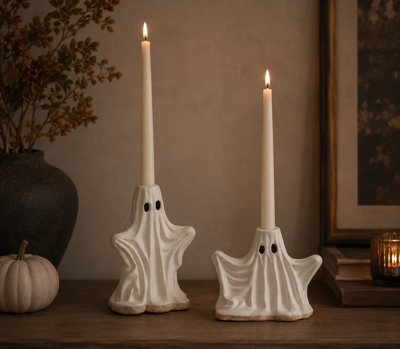 These ghost taper candle holders from Pottery Barn are the perfect mix of spooky and charming. 👻🕯️ They’re such a fun way to dress up a mantel, dining table, or entryway, and they still fit with a cozy, neutral Halloween aesthetic. I need these on my table this fall. 🤍

#LTKHome #LTKSeasonal