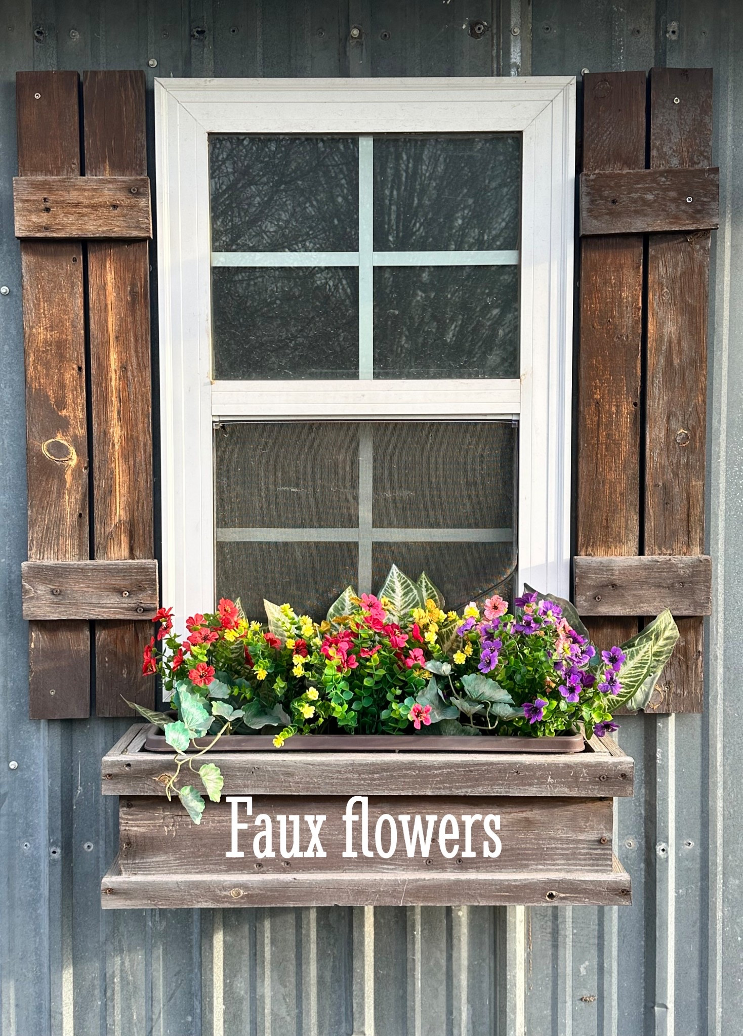 Faux flowers look bright and beautiful in my chicken house window boxes 
#fauxflowers #flowerboxes #chickenhouse 