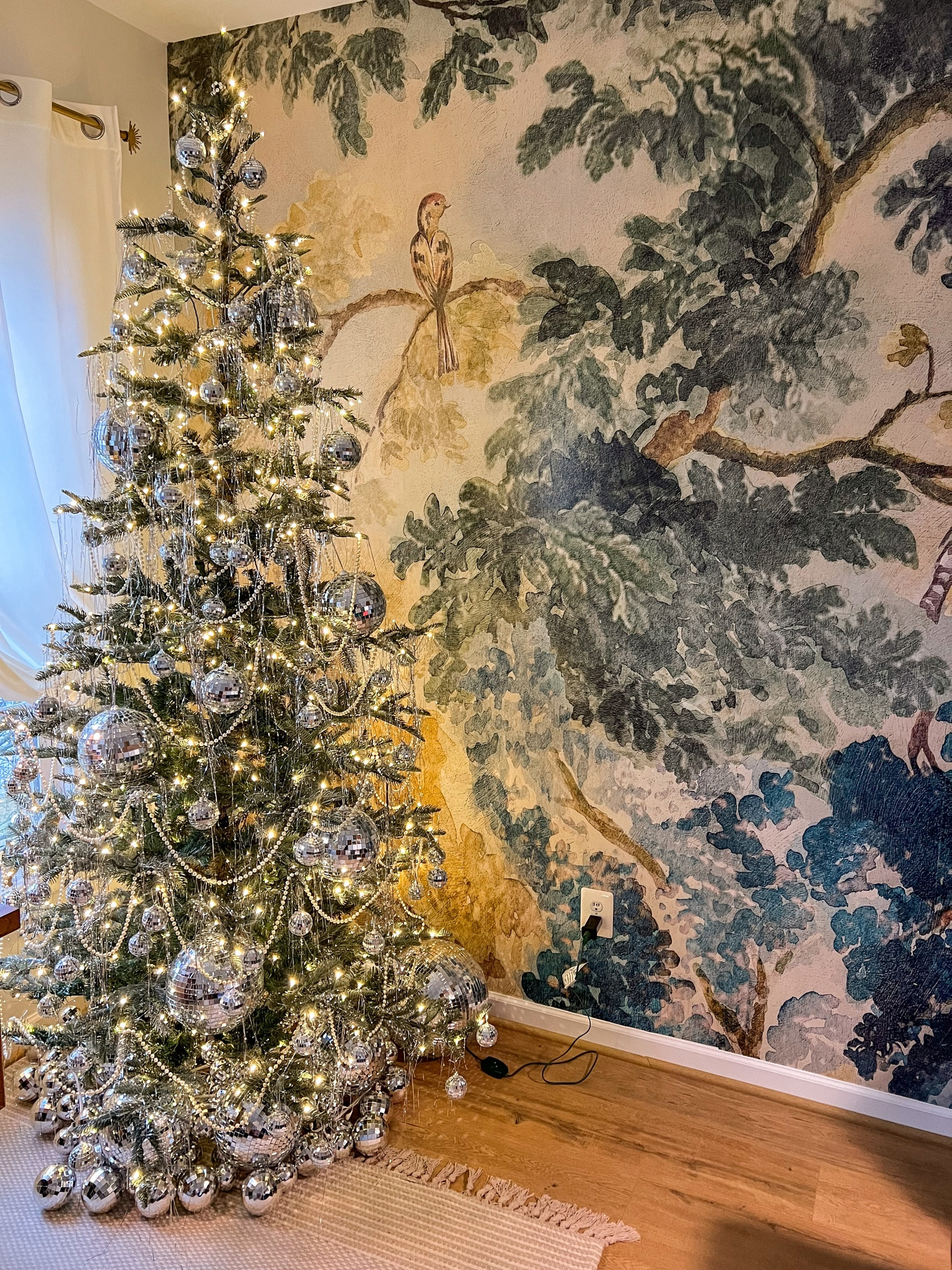 My favorite Christmas tree setup 🥰 I love the Gatsby vibes with the pearls, disco balls, and tinsel! I redo this same setup every year because the vibes just can’t be beat 🖤🪩 

#LTKHome #LTKSeasonal #LTKHoliday