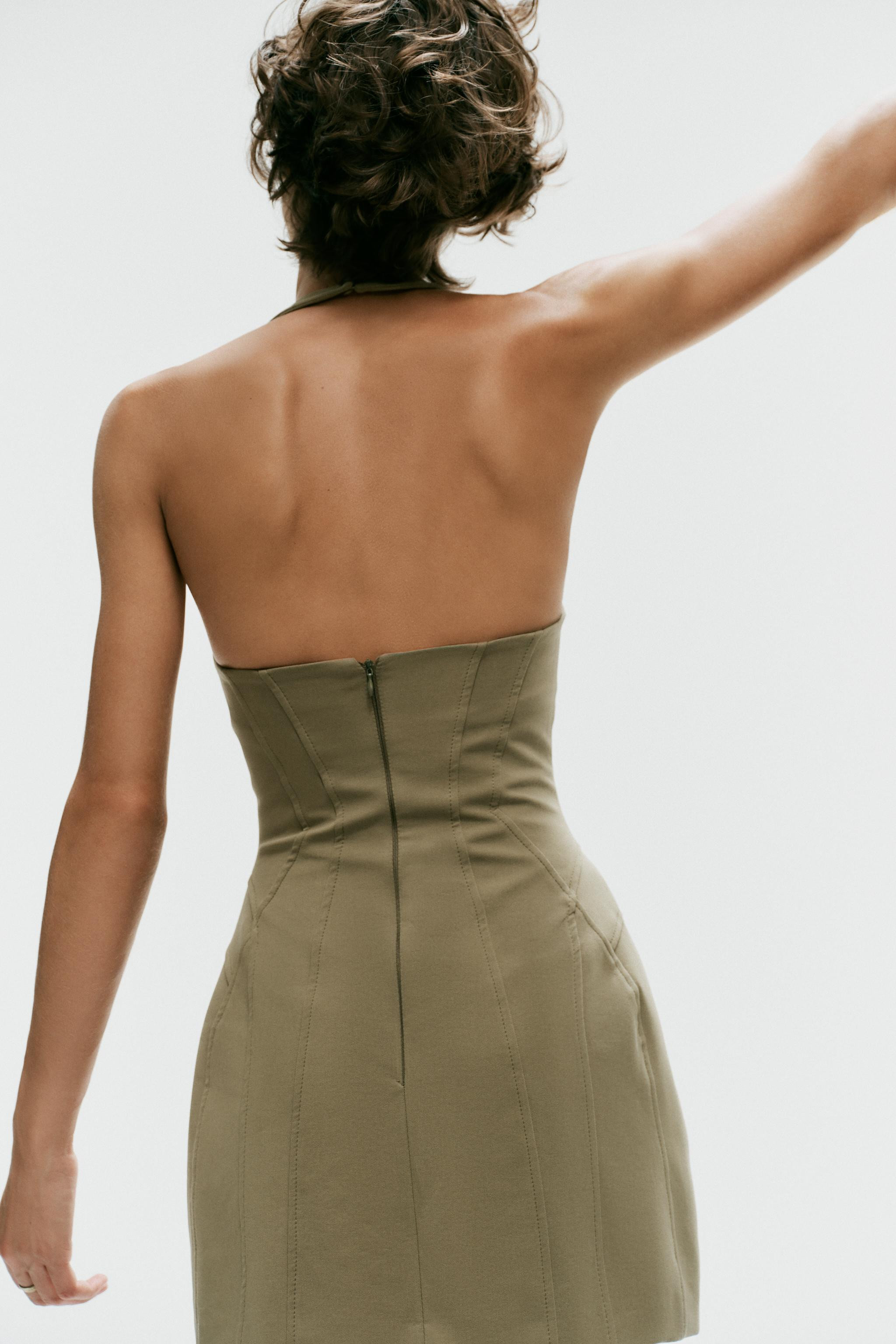 Short stretchy dress with an adjustable halter neck featuring hidden buttons and a round neckline... | Zara US