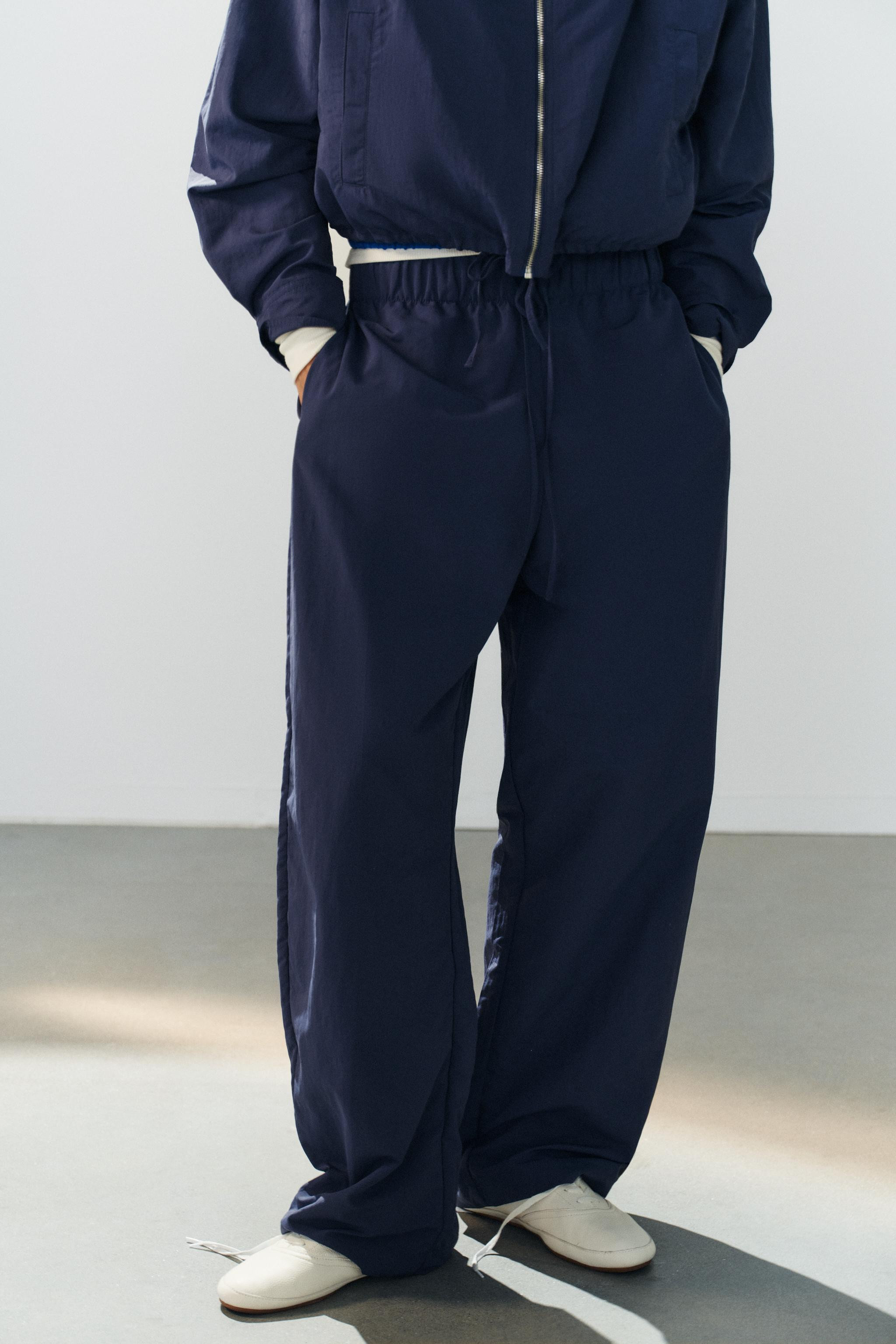 Model height: 176 cmMid-waist trousers featuring an elasticated drawstring waistband. | Zara UK
