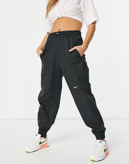 Nike Swoosh woven joggers in black | ASOS (Global)