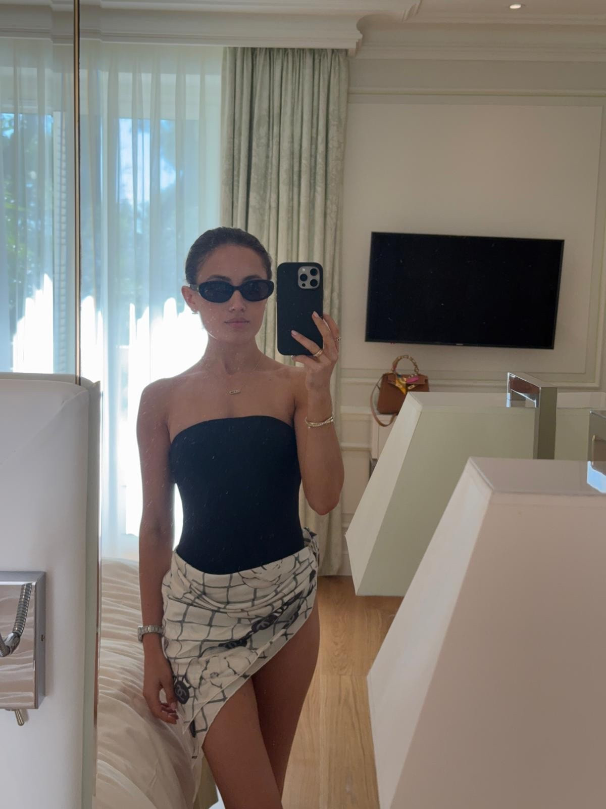 Summer chic 🖤 wearing a Monday swimwear bathing suit and sunglasses, Messika necklace , Heavenly London bracelet and a 
Chanel around my waist for the final touch 
