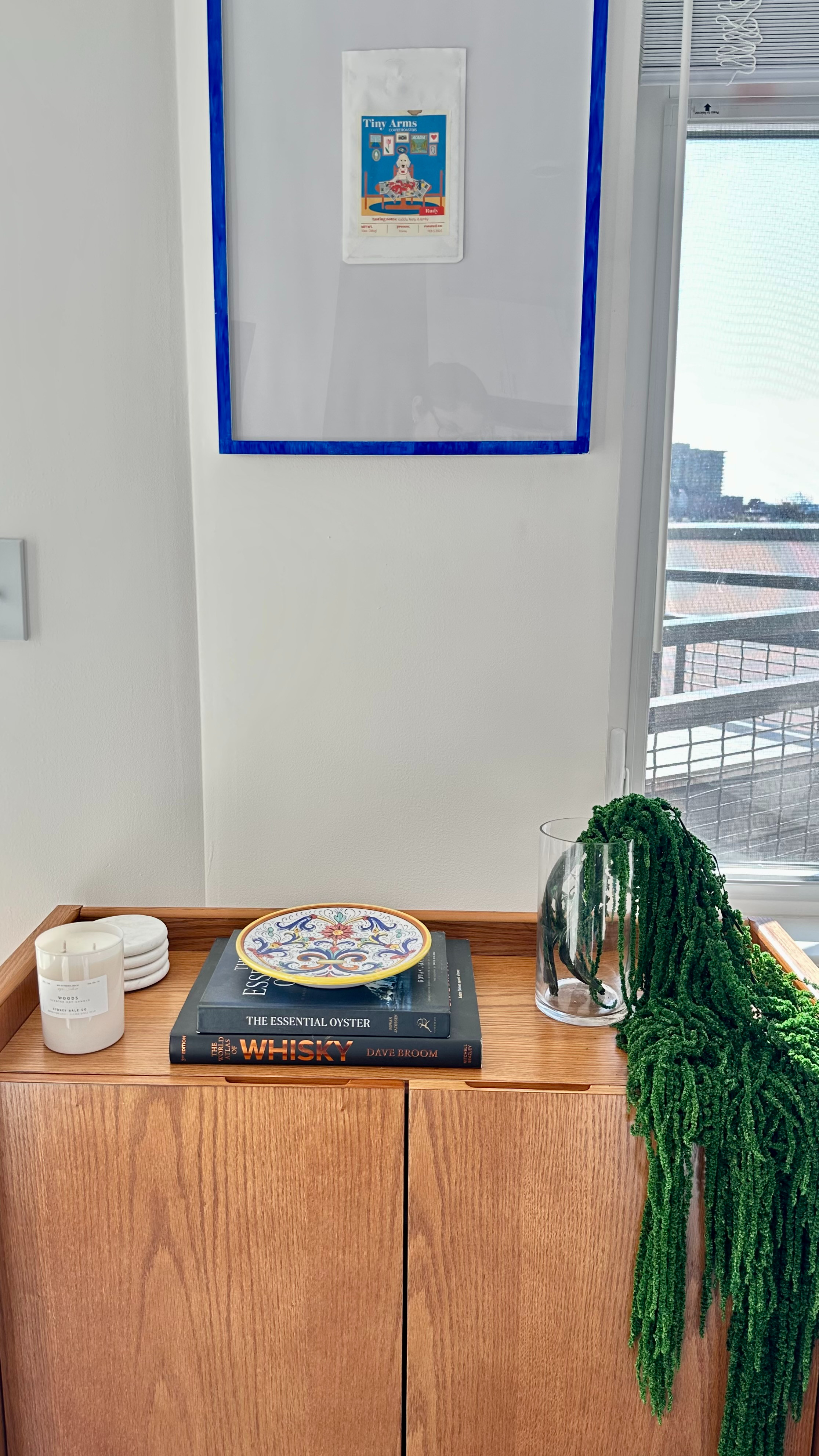 Bar cabinet has officially been set up in the living room and I love how discrete it is but also pays tribute to my boyfriend's favorite things (whisky, coffee and our dog.) Went with neutral with a little pop of color.  

 #LTKHome #LTKFindsUnder100 #LTKMens