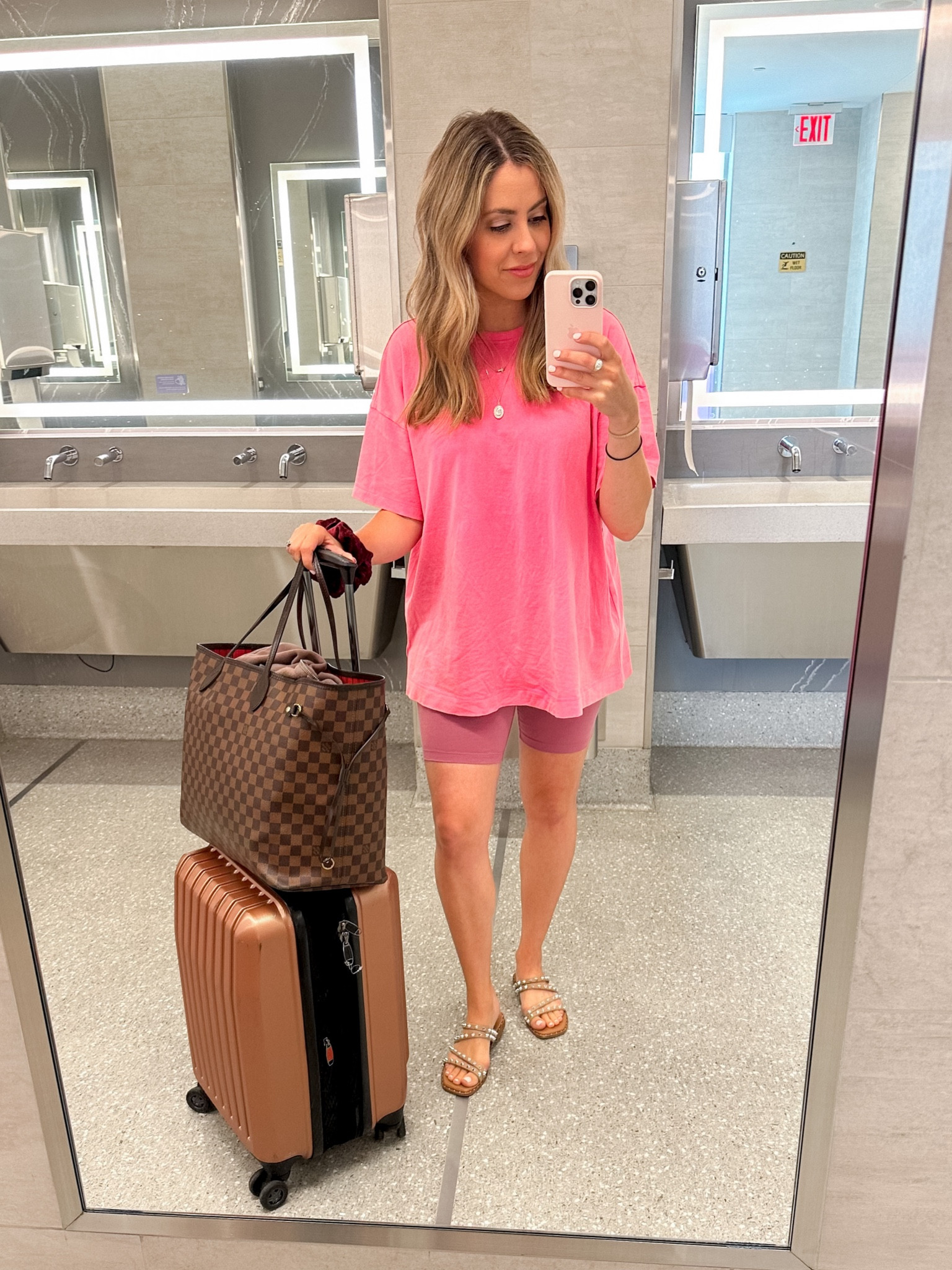 Comfortable travel day outfit - biker shorts and oversized tee  

#LTKfit #LTKtravel #LTKunder50