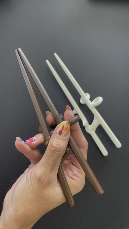 Love Asian food but struggle with chopsticks? These trainers don’t just help you pick up food, they aren’t built like tongs, but rather designed to help your hands learn the correct positioning! These reusable chopstick trainers are available for kid and adult sizes, left and right handers  #LTKxPrimeDay

#LTKfamily #LTKkids #LTKFind
