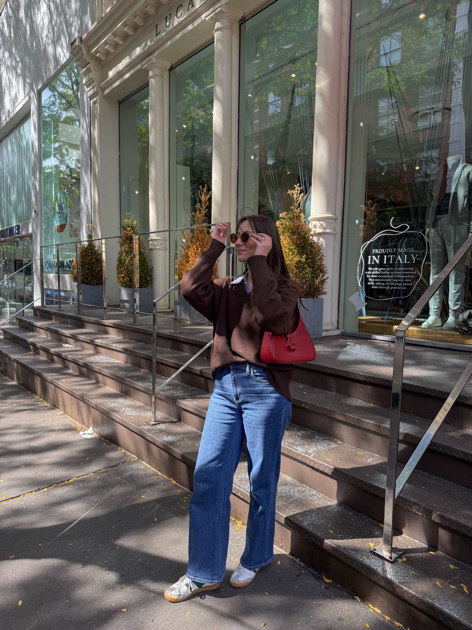 
transitional fall outfit inspo, fall fashion, fall outfit, fall outfits, fall 2025, fall dress, fall fashion, inspo, outfit ideas, outfit fall, preppy outfits, brown v neck sweater, east coast fall outfit, coastal granddaughter outfit, coastal grandmother outfit, dark wash jeans outfit, blue striped shirt outfit, oval sunglasses, miu miu sunglasses,