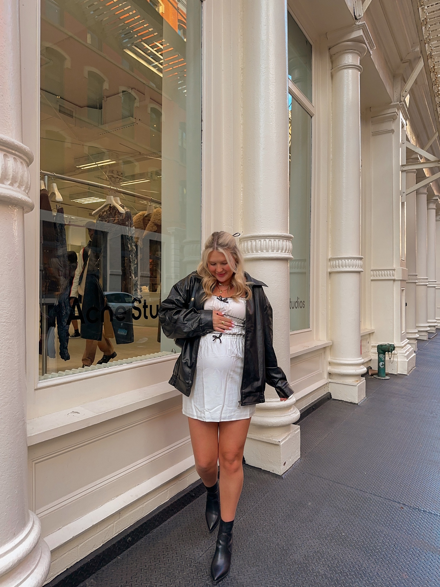 New York City street style outfit inspo, the cutest white mini dress paired with an over sized black leather bomber jacket and black boots 

#LTKstyletip #LTKtravel #LTKbump