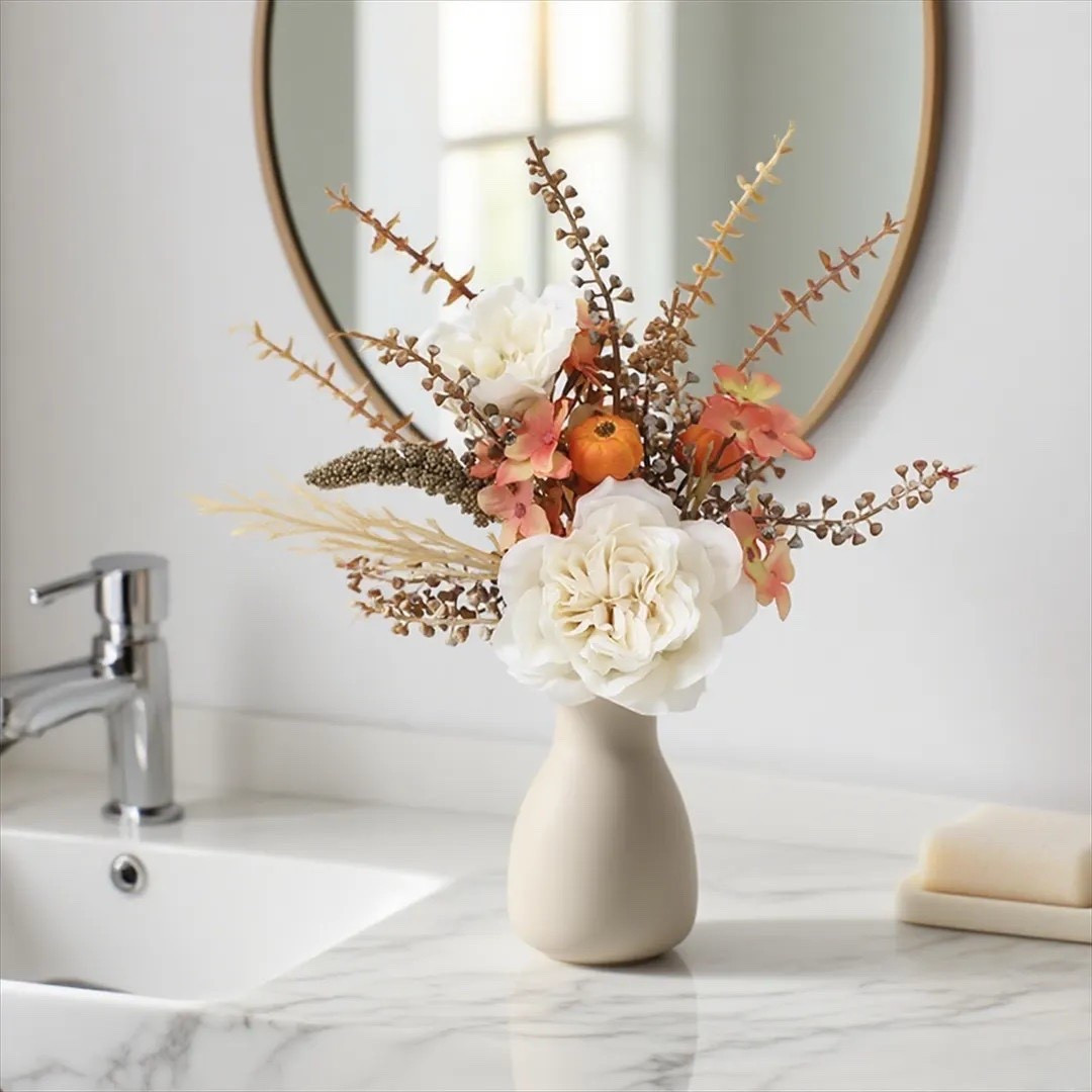 Add a touch of rustic elegance to your fall décor with RomantiFloral’s Small Pumpkin Rose Reed Faux Bouquet. 🍂 Featuring warm pumpkin accents, delicate roses, and soft reed details, this 14.96-inch arrangement brings cozy harvest vibes to any space without the fuss of maintenance. Perfect for small tabletops, dining tables, or even console displays, it’s a timeless piece you’ll enjoy year after year. 🎃✨ #FallDecor #RusticStyle #FauxFlorals #EtsyFinds #PumpkinDecor #RomantiFloral #CozyHomeVibes

#LTKSeasonal #LTKFindsUnder50 #LTKHome