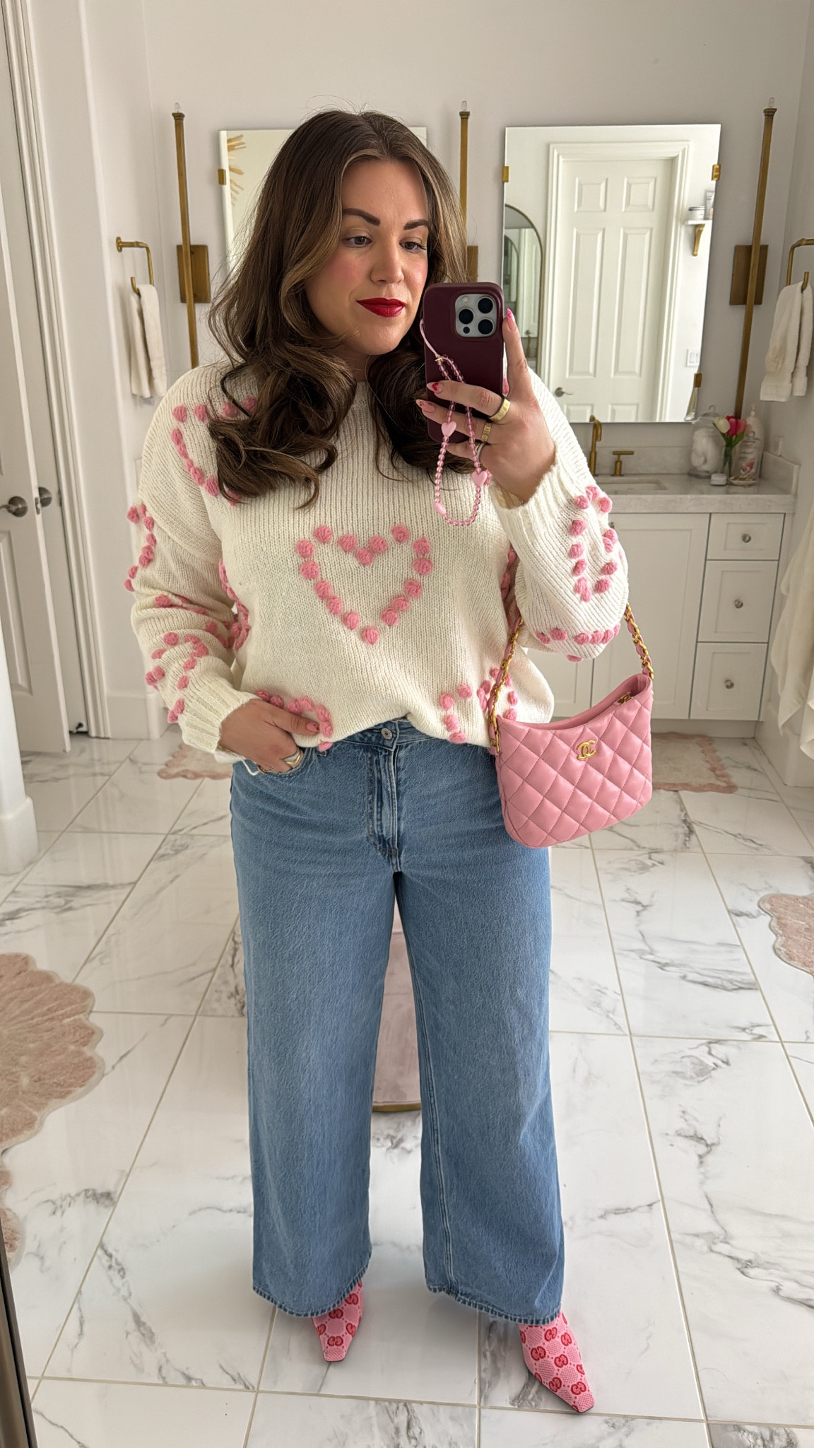 curvy midsize valentine galentine outfit! wearing size large in pink heart sweater and size 31 in wide leg denim. booties are a few years old from Gucci 

#LTKSeasonal #LTKSaleAlert #LTKMidsize