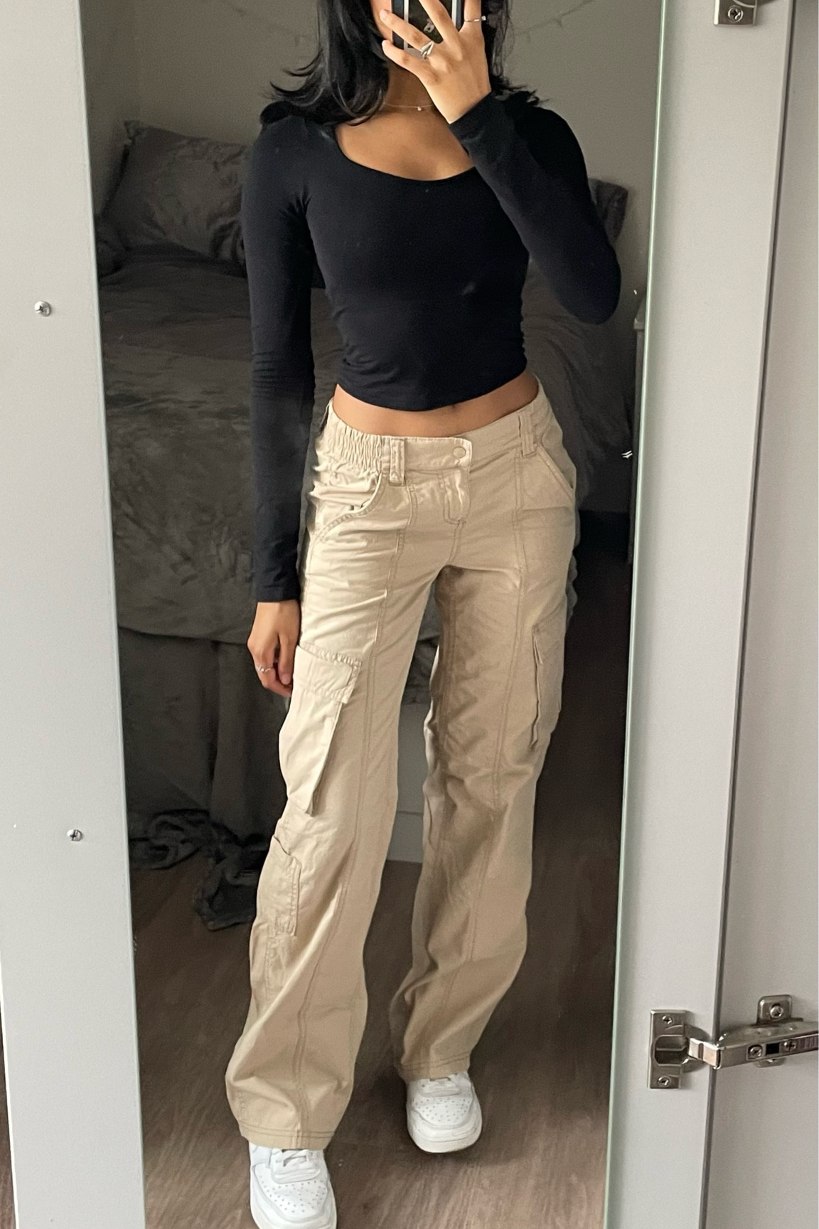 Beige cargo pants and flattering slim fit black long sleeve. Perfect white sneakers, everyday white shoes. Perfect for everyday casual school outfits

#LTKworkwear #LTKstyletip