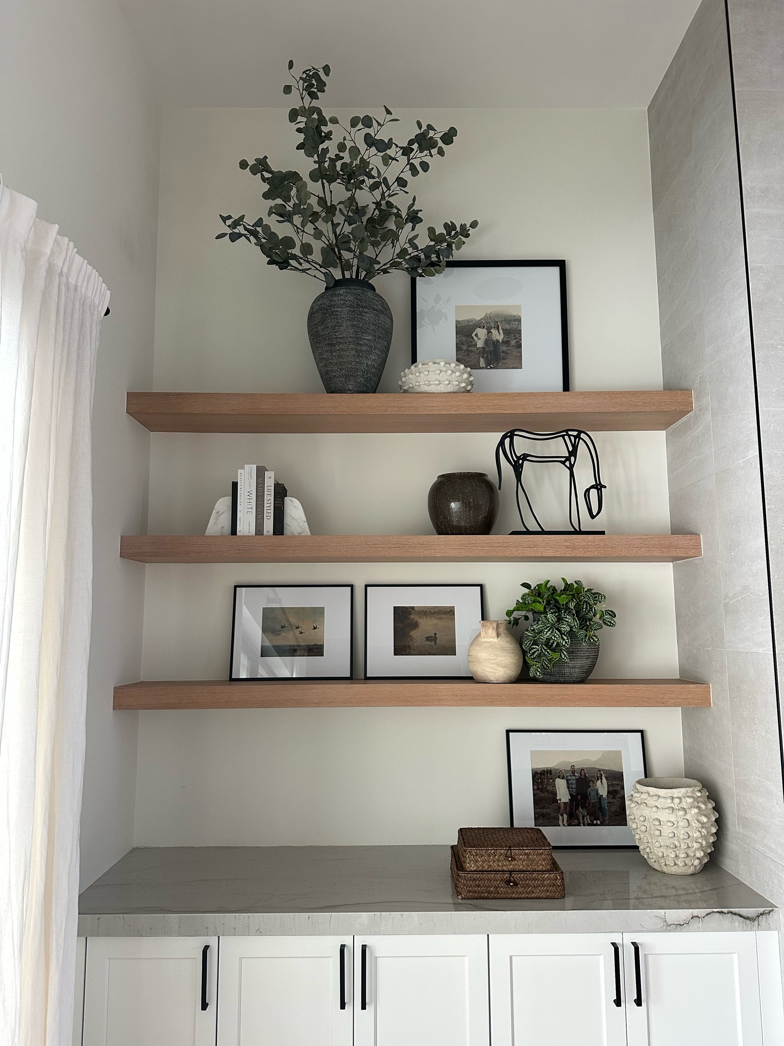 Shelf decor and styling 

Client design…TV in the middle with fireplace. Other side coming soon...

We need to fill in the bottom left but otherwise her styling is complete 

#LTKHome