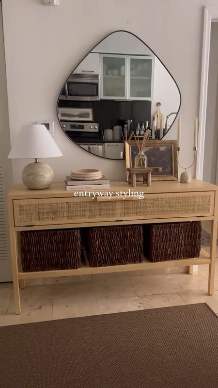 neutral, earthy, organic modern entryway styling 

console table, baskets, lamp, mirror, home decor, candle holder, candles

#LTKVideo #LTKhome