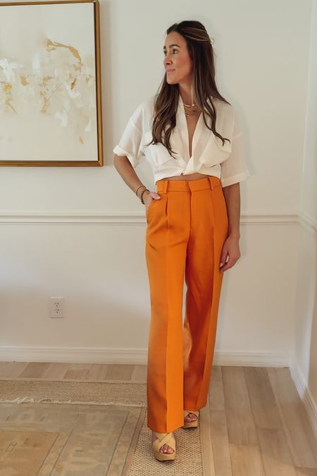 $24 H&M knot top paired with these orange (orange is trending for spring) $34 Dressy pants - have a high waist. Pleats at top, zip fly with hook-and-eye fastener, and a concealed button. Diagonal side pockets, welt back pockets, and straight, wide legs with creases. Run a tad small, if you’re in between sizes, size up. Wearing size 2. 



#LTKstyletip #LTKunder100 #LTKunder50