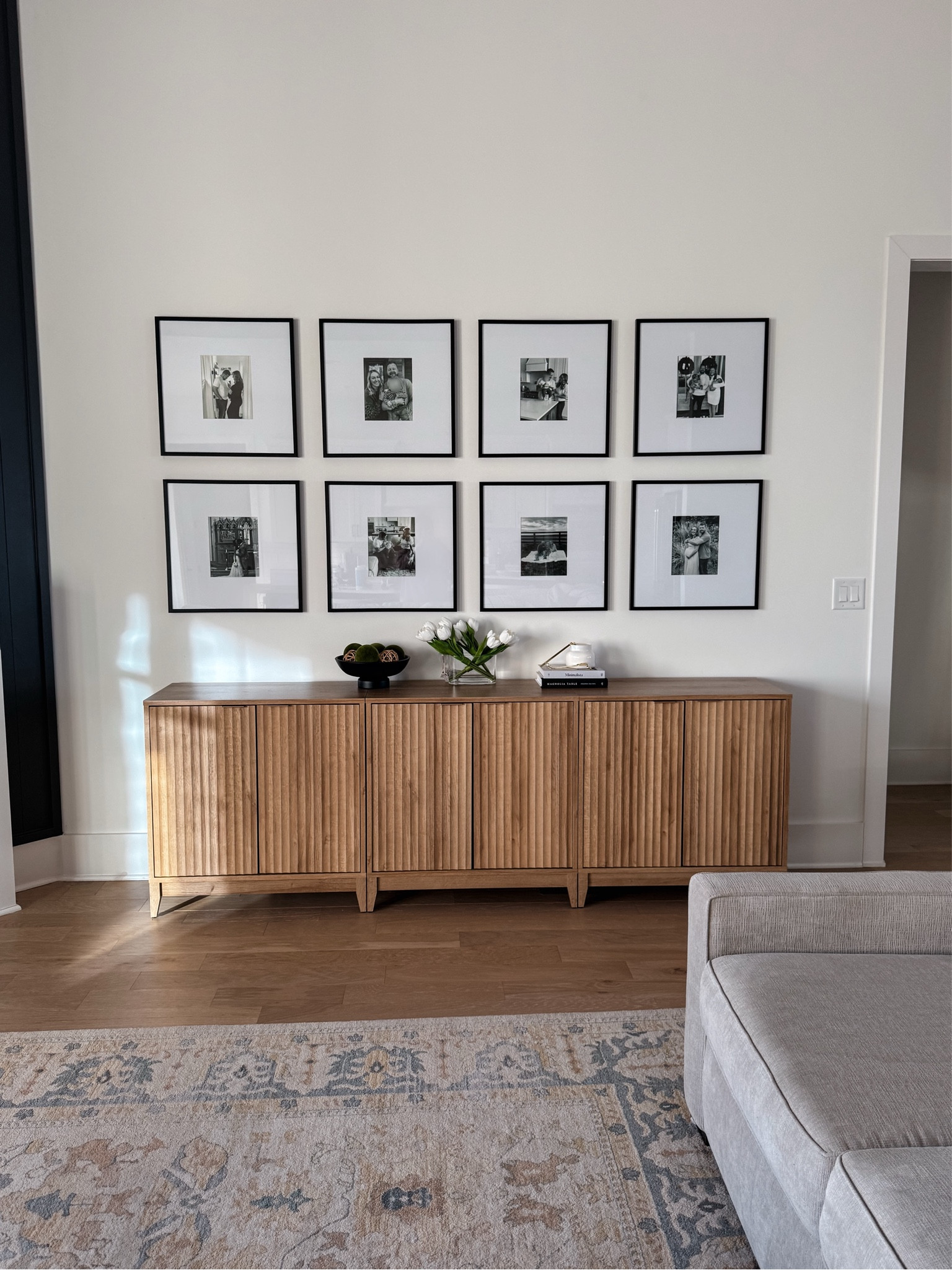Black matted picture frame gallery wall, wood media console, natural wood sideboard, living room credenza, entryway table, wooden cabinet, armoire,buffet table decor, console table decor, modern farmhouse living room, glass vase spring tulip flower, black decor bowl, moss balls decorative bowl filler 

#LTKHome