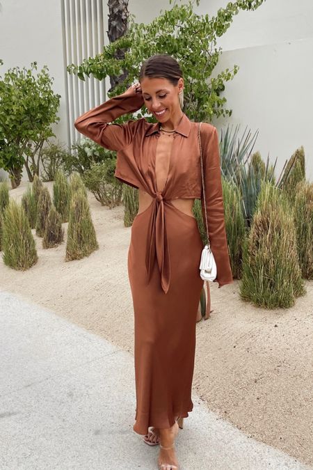 Vacation style. Long sleeve satin dress. Brown dress. Vacation dress. Front tie dress. 

#LTKstyletip #LTKSeasonal #LTKtravel