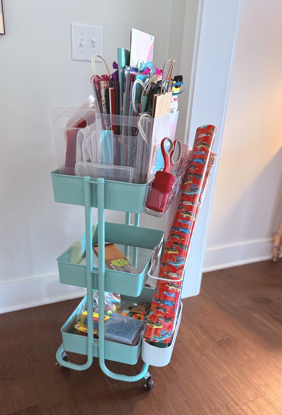 This gifting simple system makes me so happy 🤣🎉✨ top self is bags, tissue paper, cellophane bags, tags! I keep my ready to wrap and wrapped gifts on the second self. Bottom is for ready to grab gifts aka things I find and think they could be a great gift but no occasion in mind yet. 

#LTKSaleAlert #LTKHome #LTKFindsUnder50