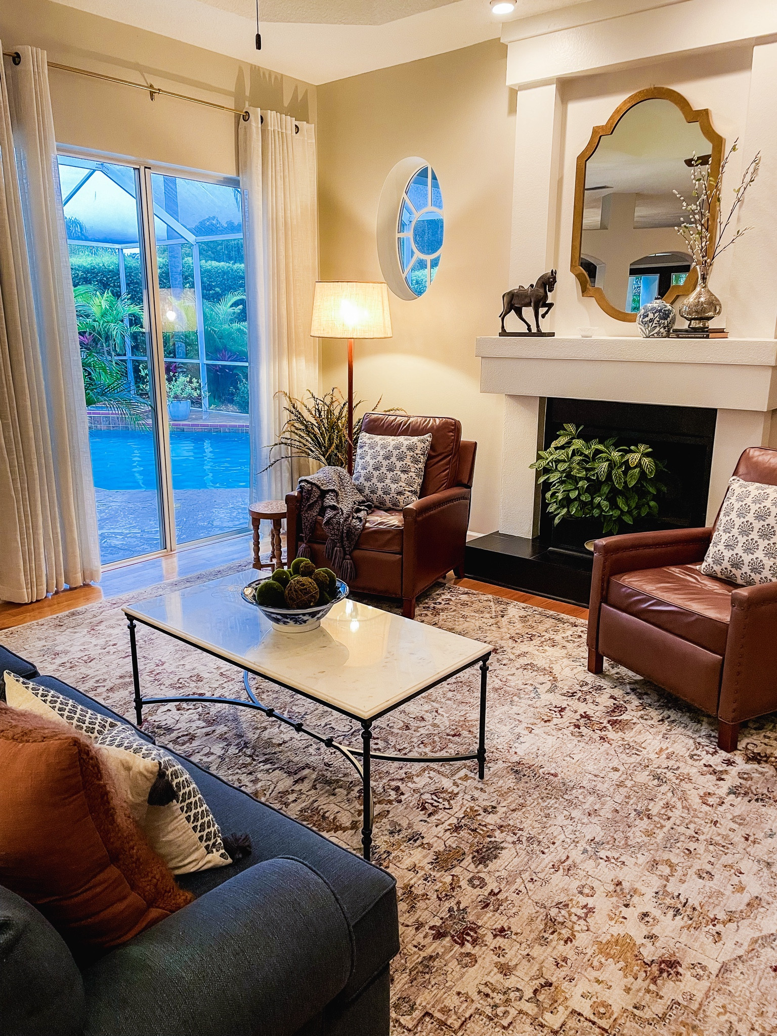 These leather armchair recliners are worth the splurge! They are beautiful but also so functional-they come in several colors and you can get them with or without the nailhead detail.  I’ve also linked options for the the coffee table, rug and mirror below. 

#LTKVideo