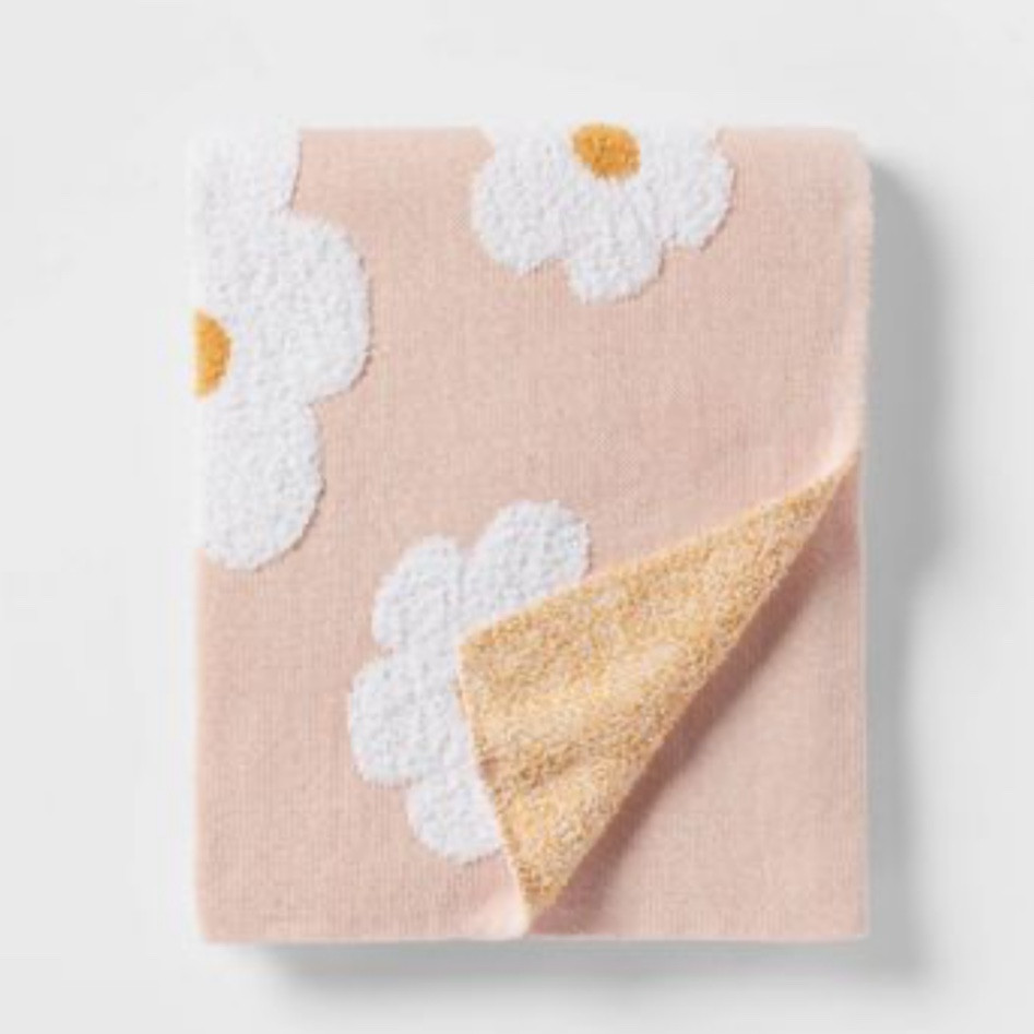 Adorable daisy print knit throw blanket at Target! Perfect for a little girl’s room 🥰 

#LTKhome #LTKunder50 #LTKkids