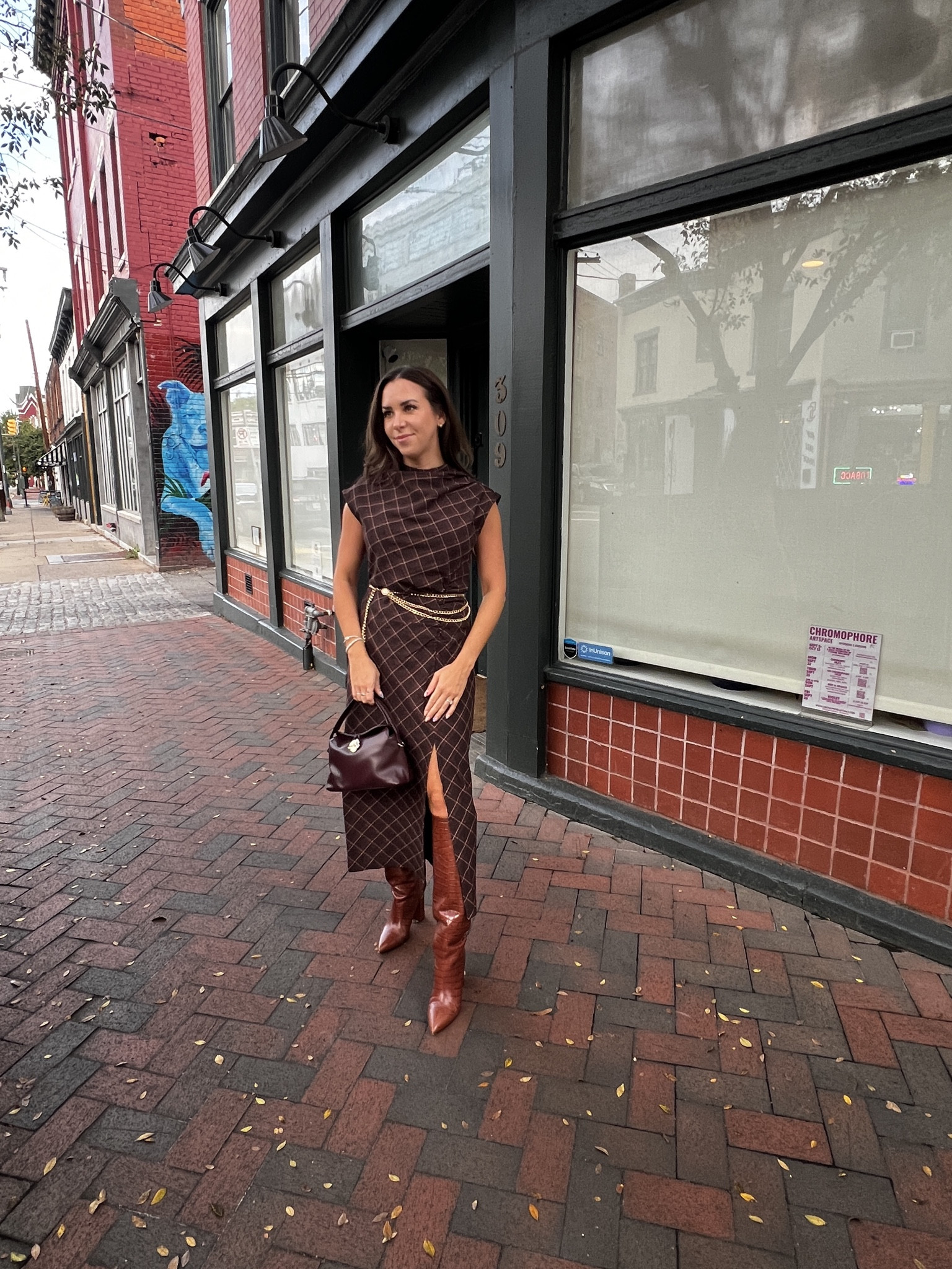 the ultimate fall outfit - a brown midi dress with a high neckline and slit, paired with brown knee high leather boots, a burgundy leather bag, and a gold chain belt to pull it all together. 

paris texas boots. flattered purse. amazon gold chain belt. plaid brown dress. midi dress. rent the runway. fall outfit. fall date night. 

 #LTKootd #LTKSaleAlert #LTKWorkwear