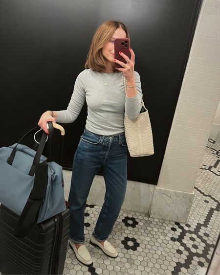 Casual outfit of the day NYC
Straight leg jeans AGOLDE Lana (my wash is sold out, linked similar wash)
Grey boatneck top Gap
White loafers Koio
Ivory woven leather tote bag Madewell 
Carry on rolling bag Beis

#LTKStyleTip #LTKTravel #LTKxMadewell