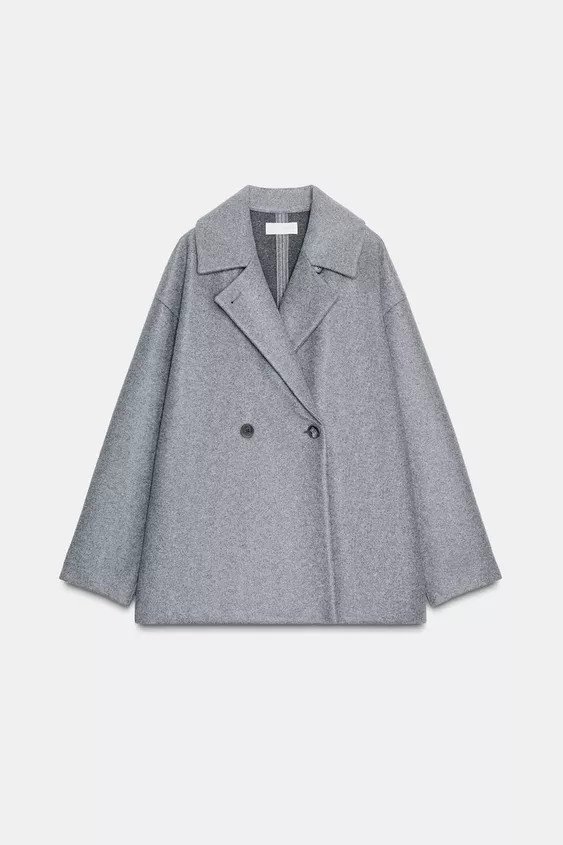 Short coat with lapel collar and long sleeves. Straight hem. Front double-breasted button closure... | Zara US