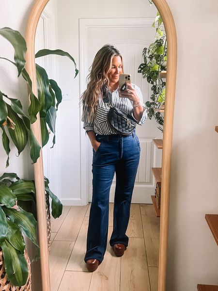 This Walmart button down top is so good!! It’s under $20 & comes in blue striped too. Wearing size large for an oversized fit. It does fit TTS. 
Jeans fit TTS. Wearing size 6. 

#walmart #walmartfashion #walmartstyle #fallfashion #falloutfit 
