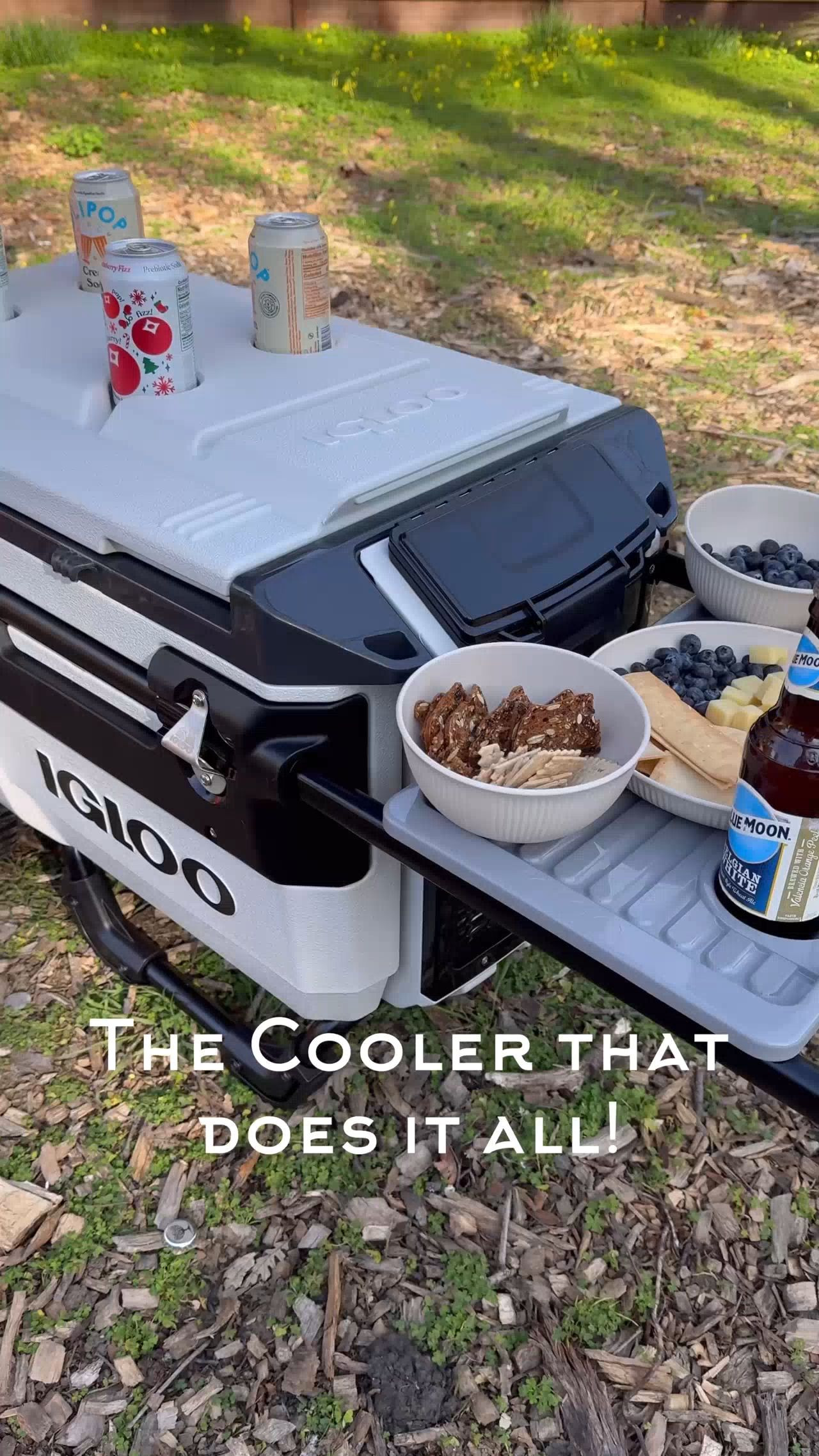 This cooler really does it ALL!

- Oversized wheels to handle any terrain!
- Dry storage & easy access storage pocket.

- 70 quart capacity holds up to 112 cans and keeps ice cold up to 4 DAYS!😱

- Butlers tray for fun picnicking!

- Bottle opener
- Phone or tablet holder
- Removable food tray to keep food dry.
- 2 accessory holders for umbrella & fishing rod.
- And handy tie down loops for extra hauling!

Summer fun
Beach days
Summer entertaining 
Outdoor fun
#amazonhome 

 #LTKHome #LTKStyleTip