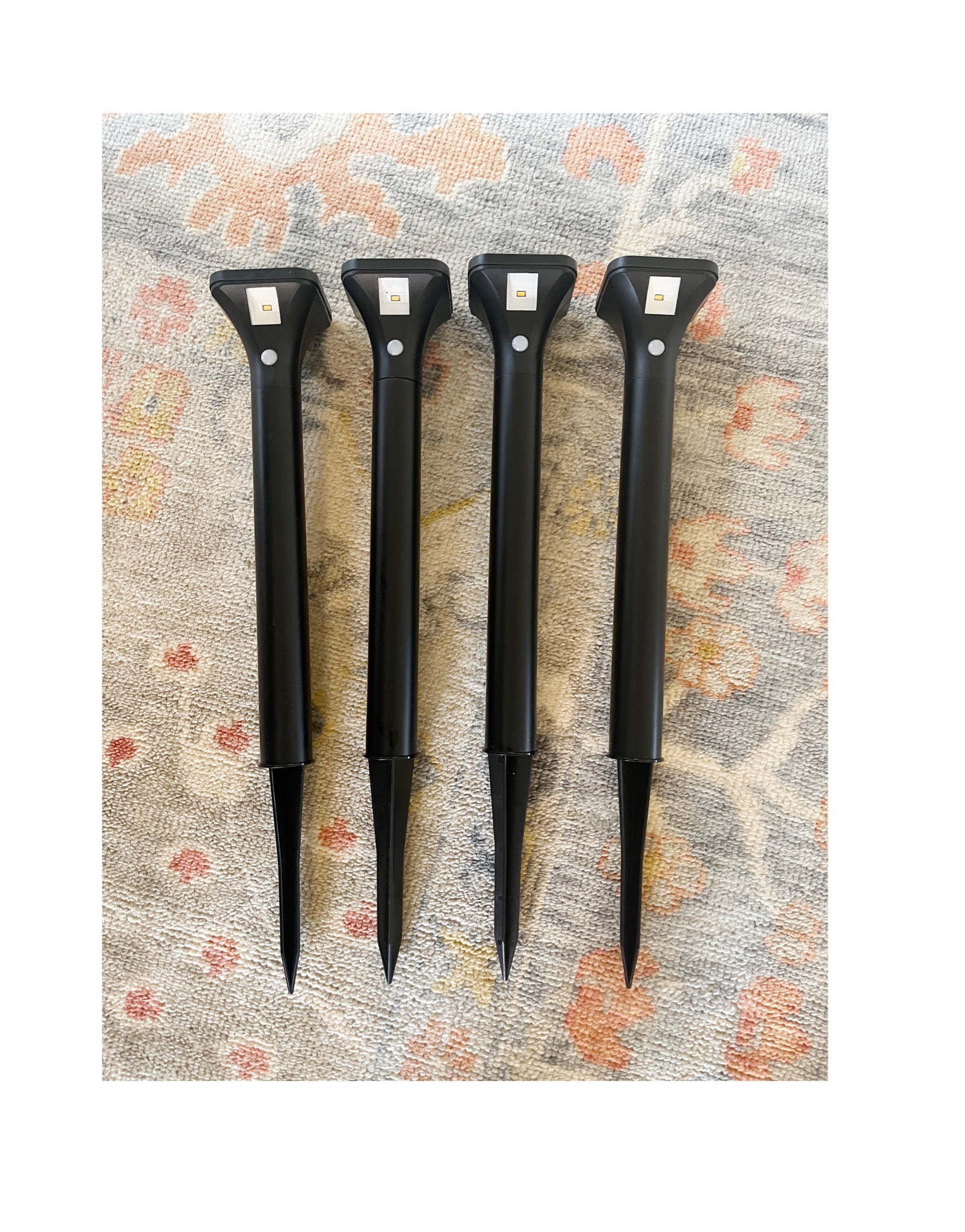 I needed light on my walkway, but didn’t want to have an electrician hardwire lights. I hid these in bushes/behind planters and these work well. They are on dim at night and illuminate when you walk by. They super affordable too   

#LTKsalealert #LTKhome #LTKstyletip