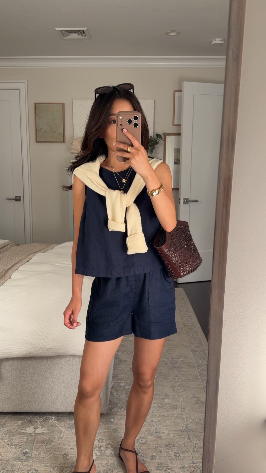 Size info below! 
• 100% linen set in XS also love this in gingham! Buttons are on the back. Both are a little loose on me but can shrink slightly in dryer and shorts have drawstring to help with fit. 
• Cashmere sweater XS 
• Reformation sandals 5.5 
• Madewell woven bag 
• Madewell sunglasses 

Easy summer mom outfits, simple casual mom outfits, petite friendly

#LTKPetite #LTKSeasonal #LTKootd