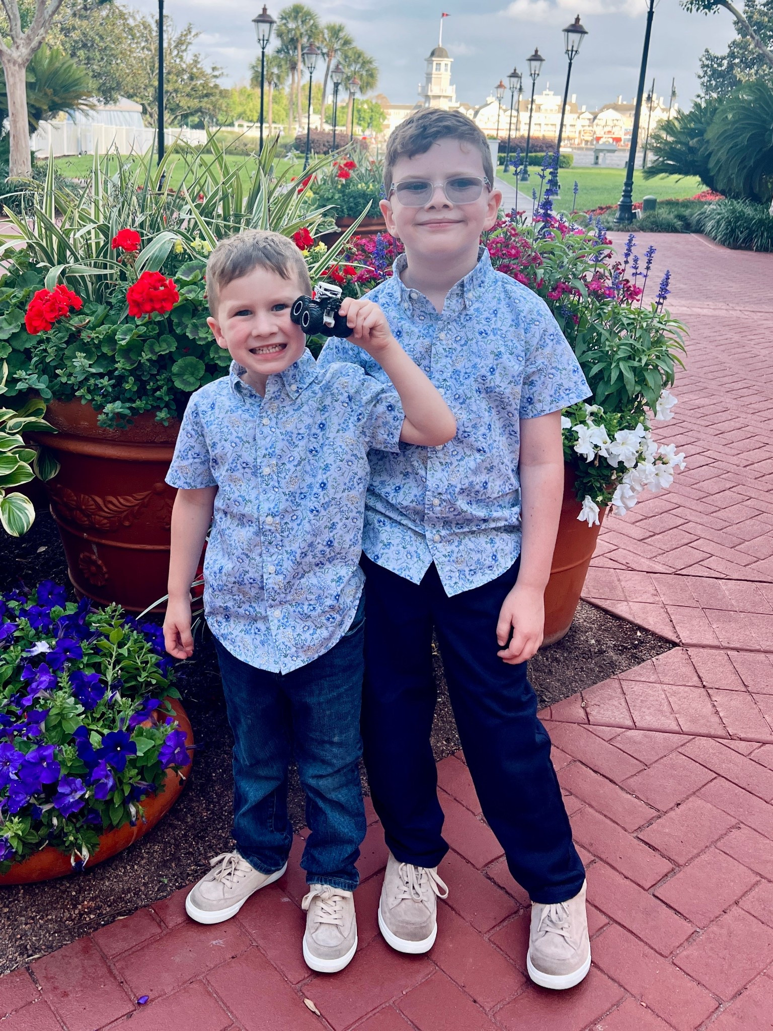 Boy Easter outfit for spring vacation. Perfect floral collared shirt for boys to dress up or dress down. We wore these to visit the Cake bake shop for our Disney world spring break vacation. Perfect for the Flower and Garden festival too! Spring boy outfit. Matching toddler and big boy ootd. 

#LTKKids #LTKSeasonal #LTKTravel