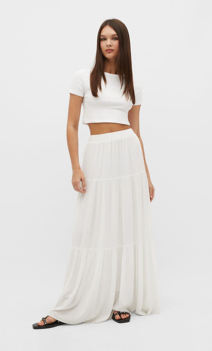 Flowing midi skirt with an elastic waistband and matching lining. Available in several colours. | Stradivarius (UK)