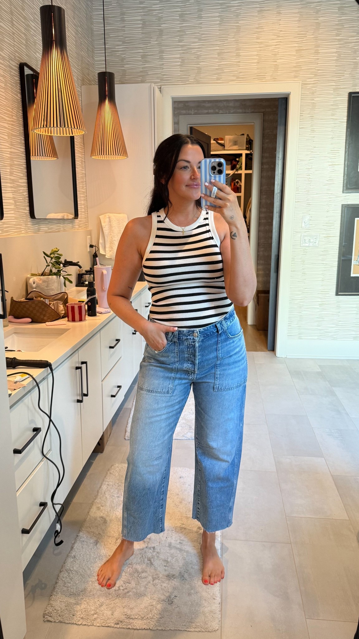 Target tank (M) on sale for $5.60! It’s a great tuckable length  Jeans are a subtle barrel leg from Madewell! They say TTS, but I wanted mine more fitted so I went down to a 29!

#LTKSeasonal #LTKSaleAlert #LTKStyleTip