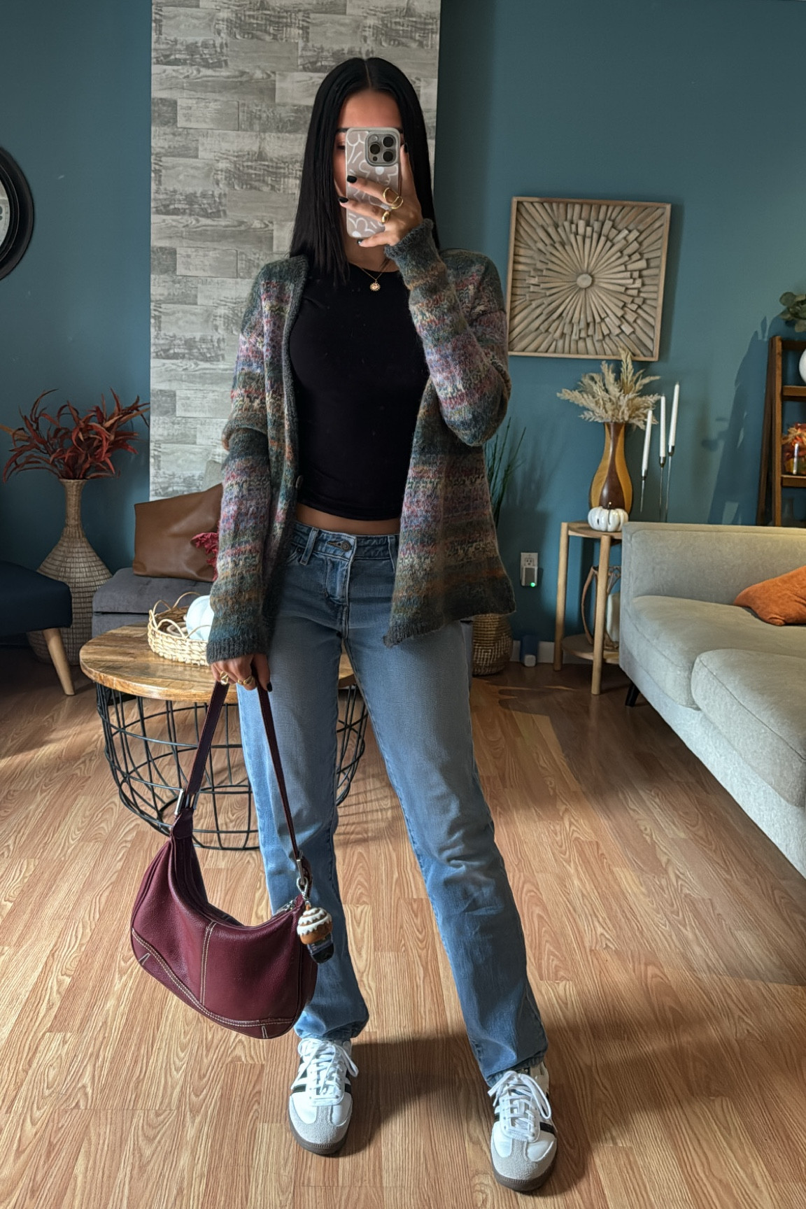 Colorful cardigan, cardigan, black tshirt, black shirt, medium denim jeans, Levi’s jeans, adidas sambas, adidas, burgundy bag, shoulder bag, gold Jewelry, gold rings 

#LTKSpringSale #LTKShoeCrush #LTKStyleTip