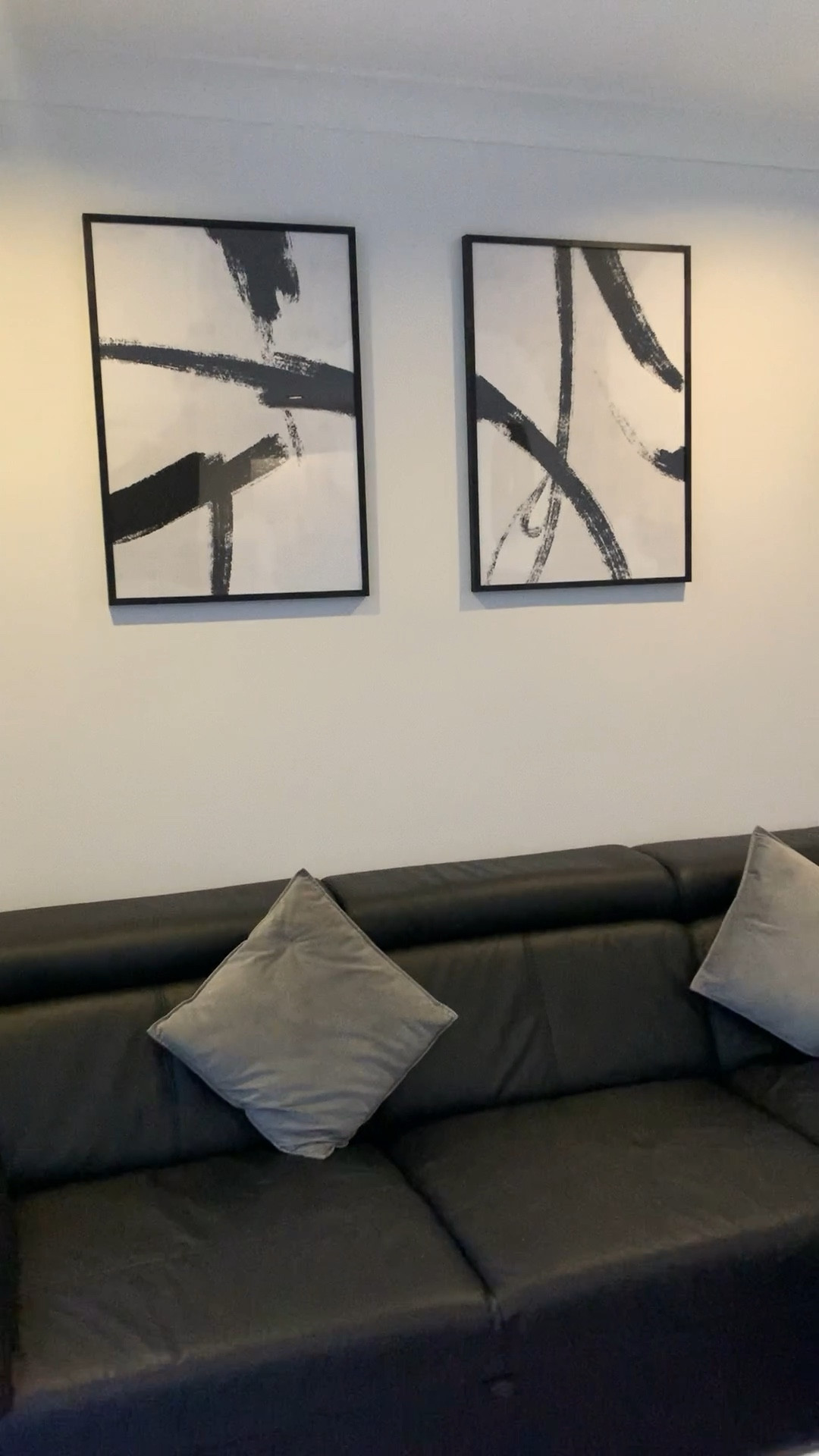 Black Leather Sofa. Desenio Wall Art. Monochrome Living Room. Velvet Grey Pillows. Grey Velvet Throw. Monochrome Home. Black and White living room. Wall Art. Green Plants. Home Interior.

#LTKeurope #LTKfindsunder100 #LTKhome