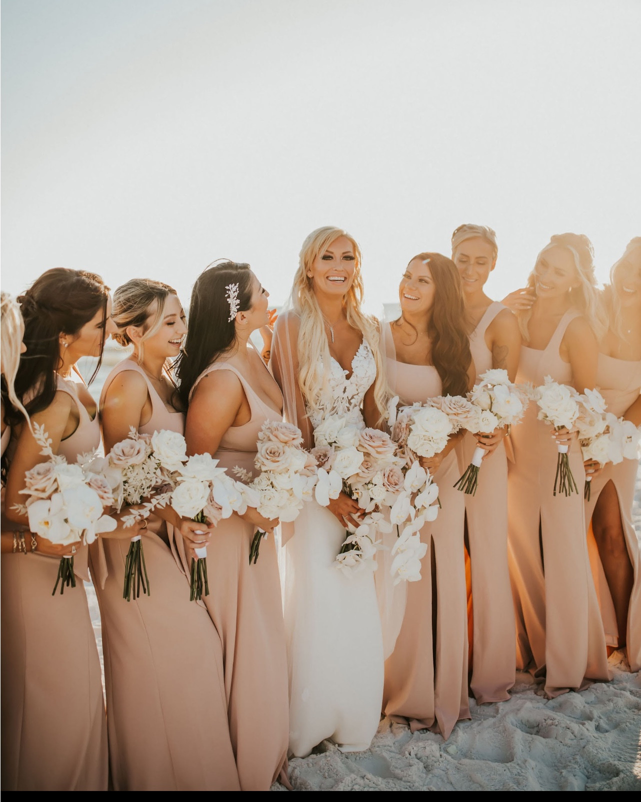 Dreaming of a white sand wedding? Then take notes from our beautiful bride who was married on the beach in sunny Destin, Florida! Her bridesmaids’ peachy-pink toned dresses complimented the sunset perfectly as they tied the knot at golden hour. ☀️

#Bridesmaiddresses #Bridesmaids #beachwedding #bride #weddingdress #bridalgown #peachdress #bridesmaid 

#LTKSeasonal #LTKBeauty #LTKWedding