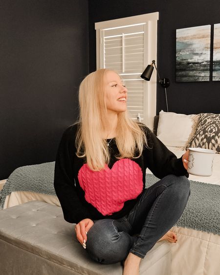 Stay warm and cozy with this super cute pullover sweater. This black and pink heart sweater would be great for Valentine's Day or any other winter day.💖 

#LTKfindsunder50 #LTKstyletip #LTKSeasonal