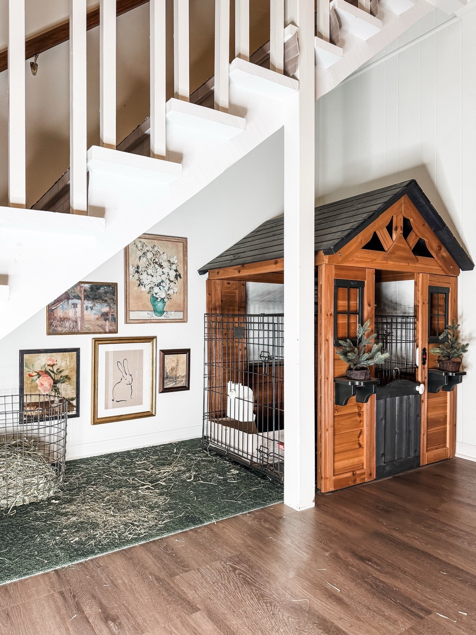 A perfectly styled pet corner that still feels like part of the home ✨ This space brings together a vintage-style gallery wall with framed artwork, black wire pet crates, a wire hay basket, and a green area rug—all tucked neatly under the stairs. Finished with a wooden pet house with metal door accents, it’s proof that pet-friendly design can be both practical and beautiful.

#petfriendlydesign #underthestairs #gallerywallinspo #functionalhome #cozycorners #eanesinteriors


#LTKvlog #LTKHome #LTKOver40
