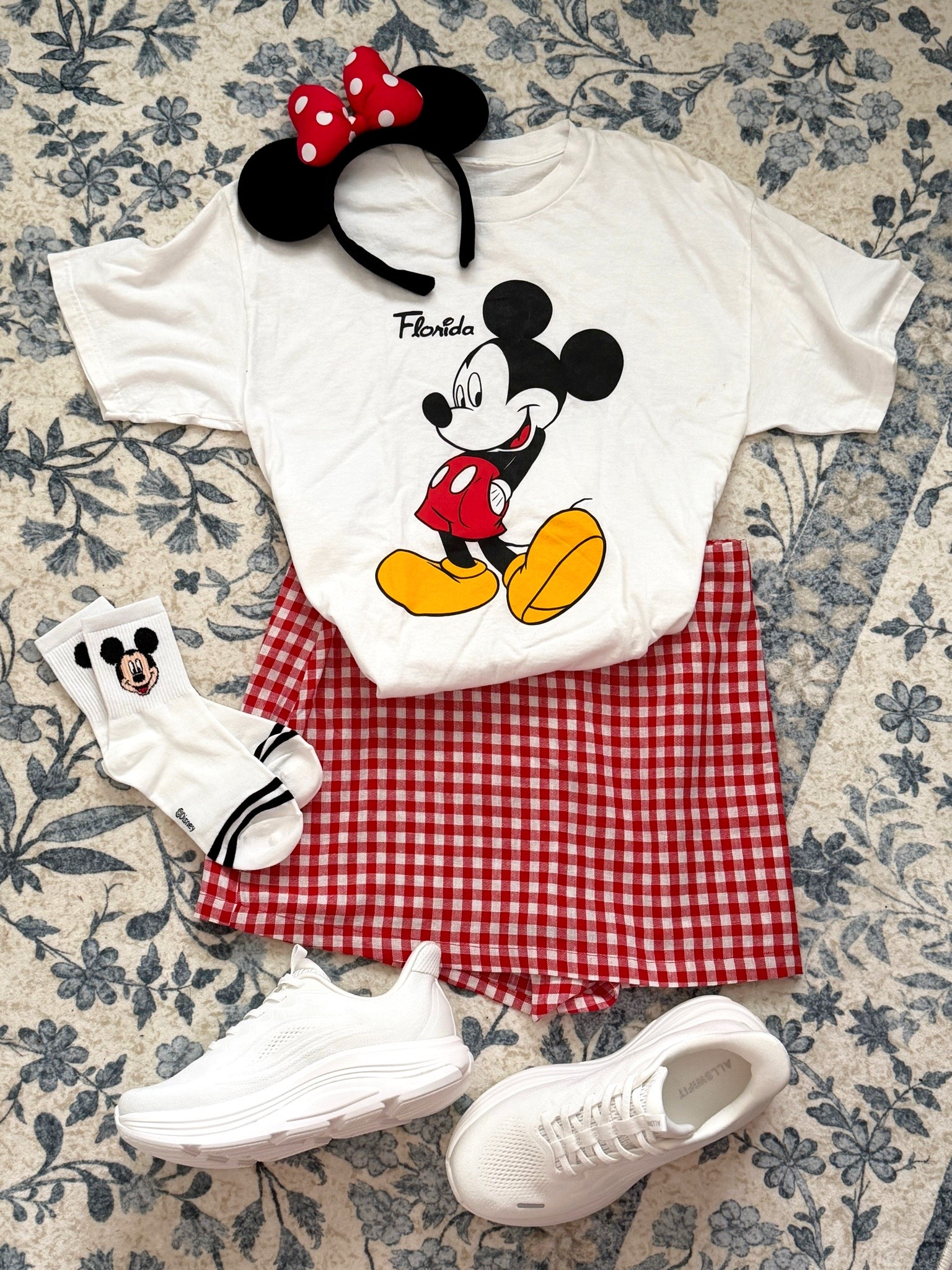 Disney Outfit Idea | Book with me @ VacationsByRebecca | I wore this in the parks and was SO comfortable and cool in the Florida heat. I LOVE how the shorts in this skirt are loose and I wasn’t pulling them down all day on and off rides. 10/10. 
The shoes are a Disney MUST. Literally my feet didn’t hurt even once! 👏🏼

The shirt is a Vintage Disney tee I found in Athens GA. I wore a large in the skirt and should have sized down to a Medium. I am typically a size 10 at Old Navy.

#LTKootd #LTKTravel #LTKSeasonal