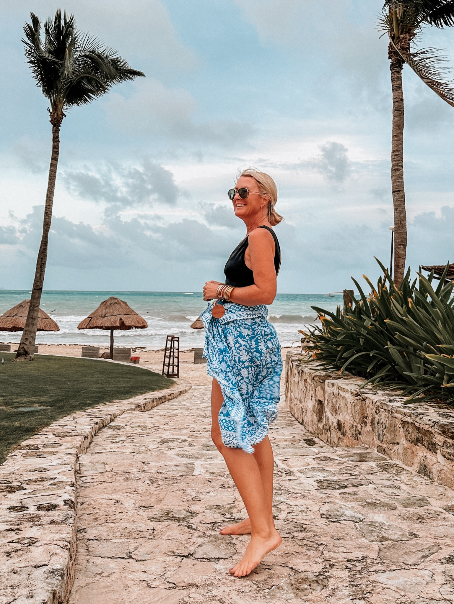 Happiest here 💙🌴 this one-piece swim has great coverage & control, but with a deep v in front and back  

#LTKSwim #LTKOver40