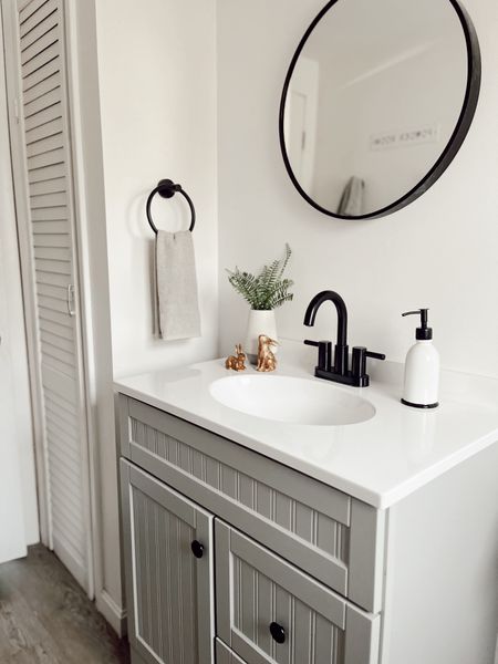 Black accessories in bathroom! Round mirror for vanity! 

#LTKhome #LTKstyletip #LTKfindsunder50